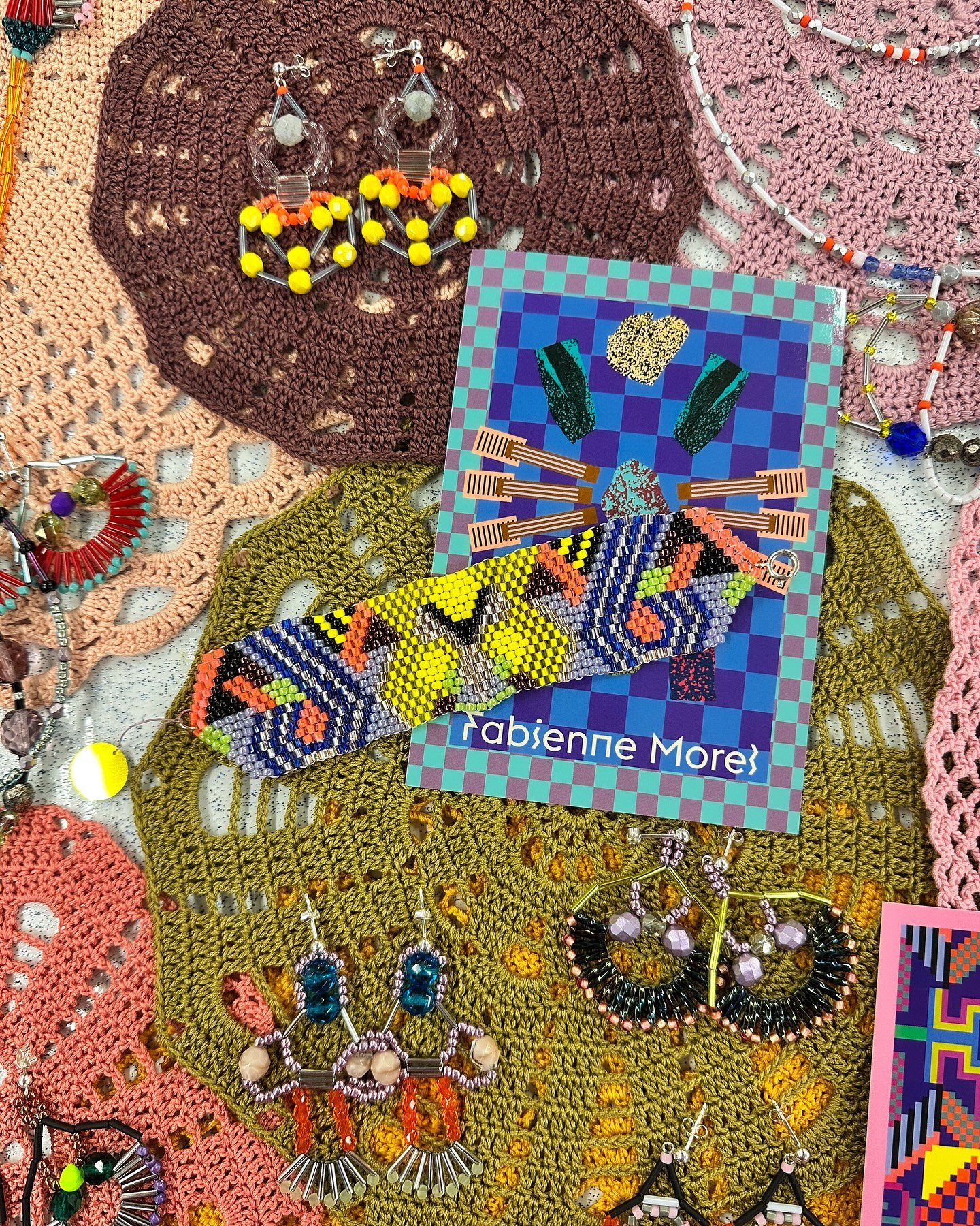 Jewelry resting on soft crochet &ndash; old textures meet new sparkle. A gentle mix of handcraft, pattern, and playful detail.

#FabienneMorel #HandcraftedJewelry #TextileMeetsJewelry #CrochetAndShine #JewelryWithSoul #PatternPlay #BeadedBeauty #Arti