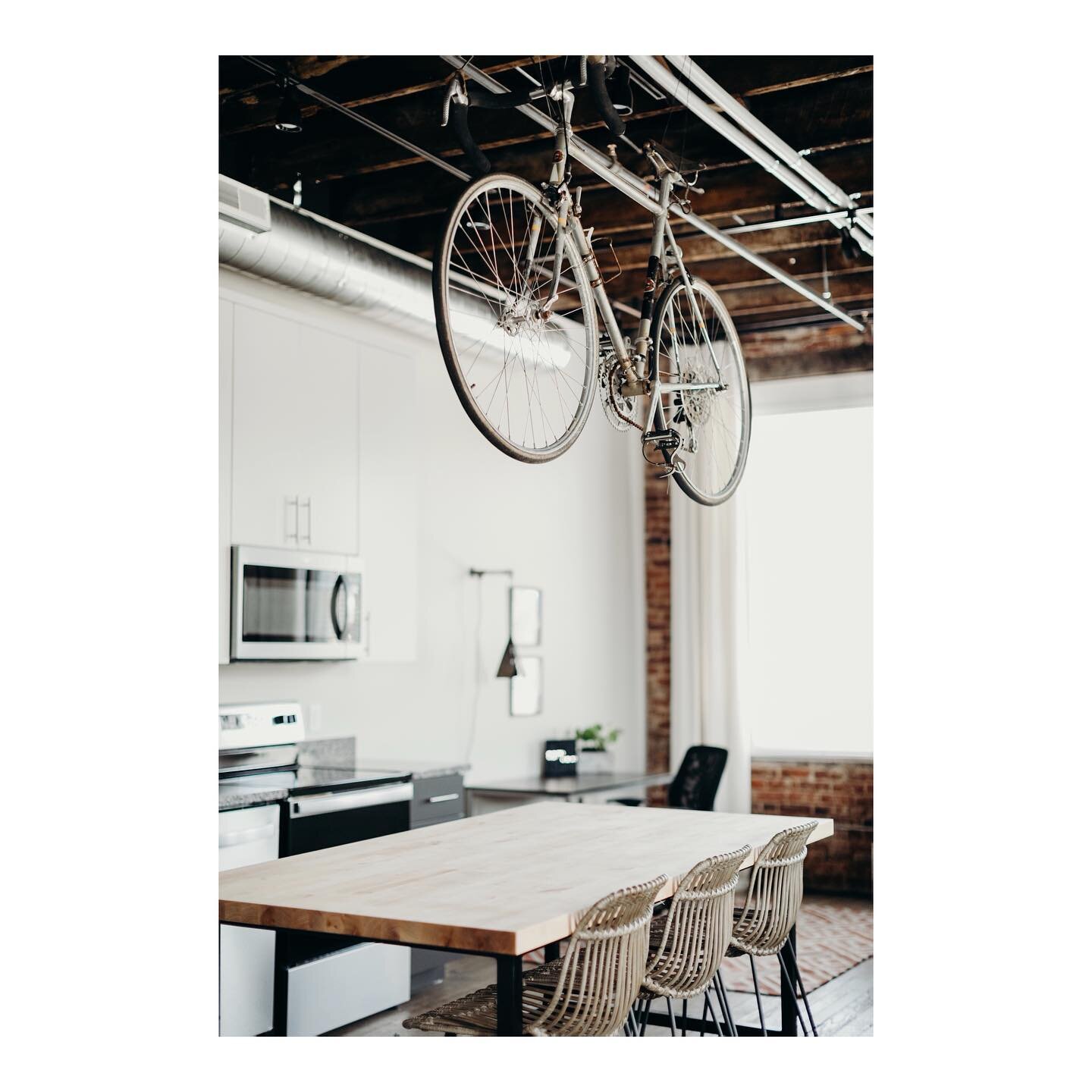 Why, yes...that is a vintage bicycle hanging above our custom built island! You wanna know why?? This is a glimpse into The Peloton Suite, which is our curated cycling loft. All four of our lofts have a different outdoor/adventure theme and since thi