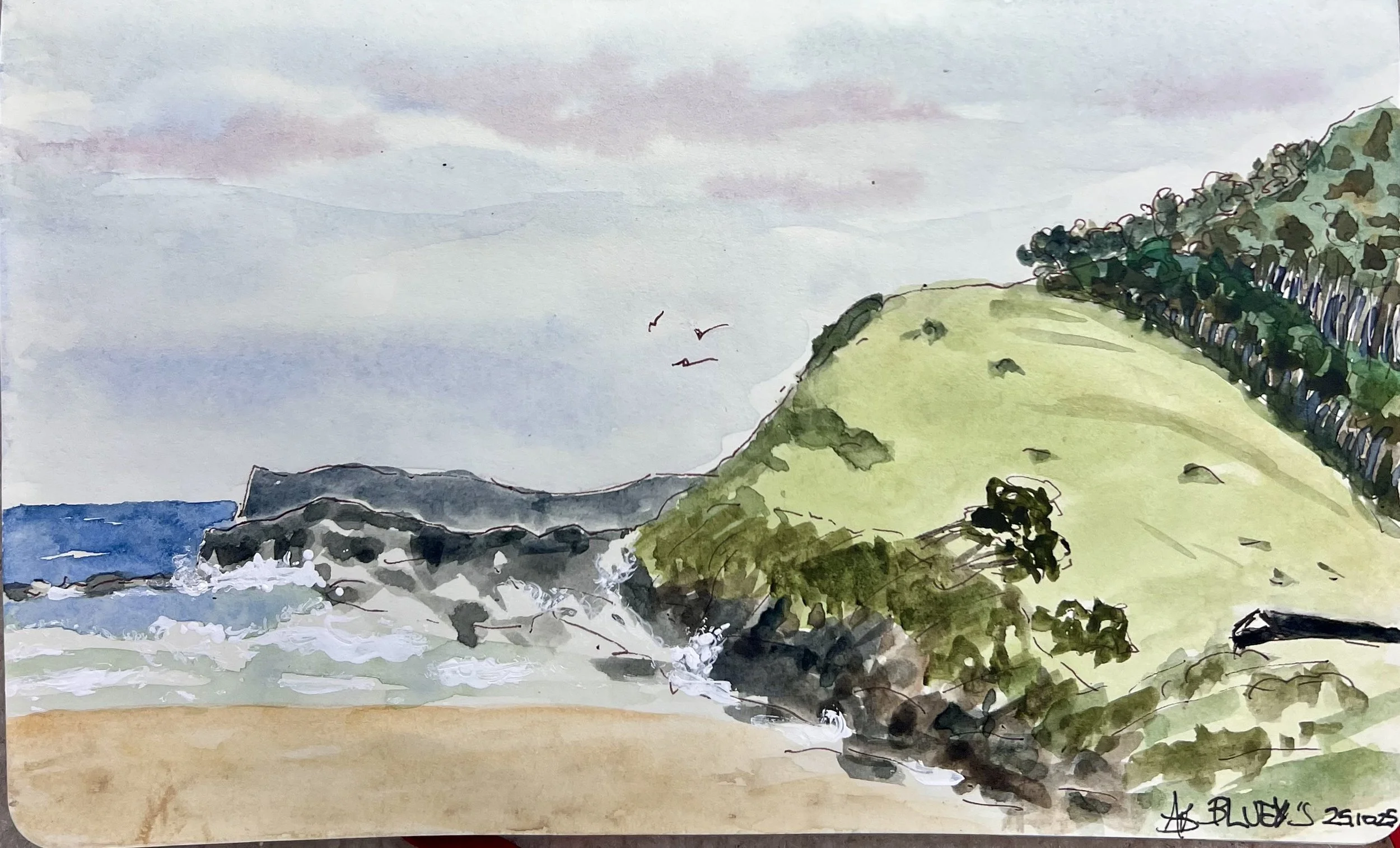 Watercolor painting of a beach with waves crashing against rocks, a grassy hill with trees on the right, and a cloudy sky with three flying birds.