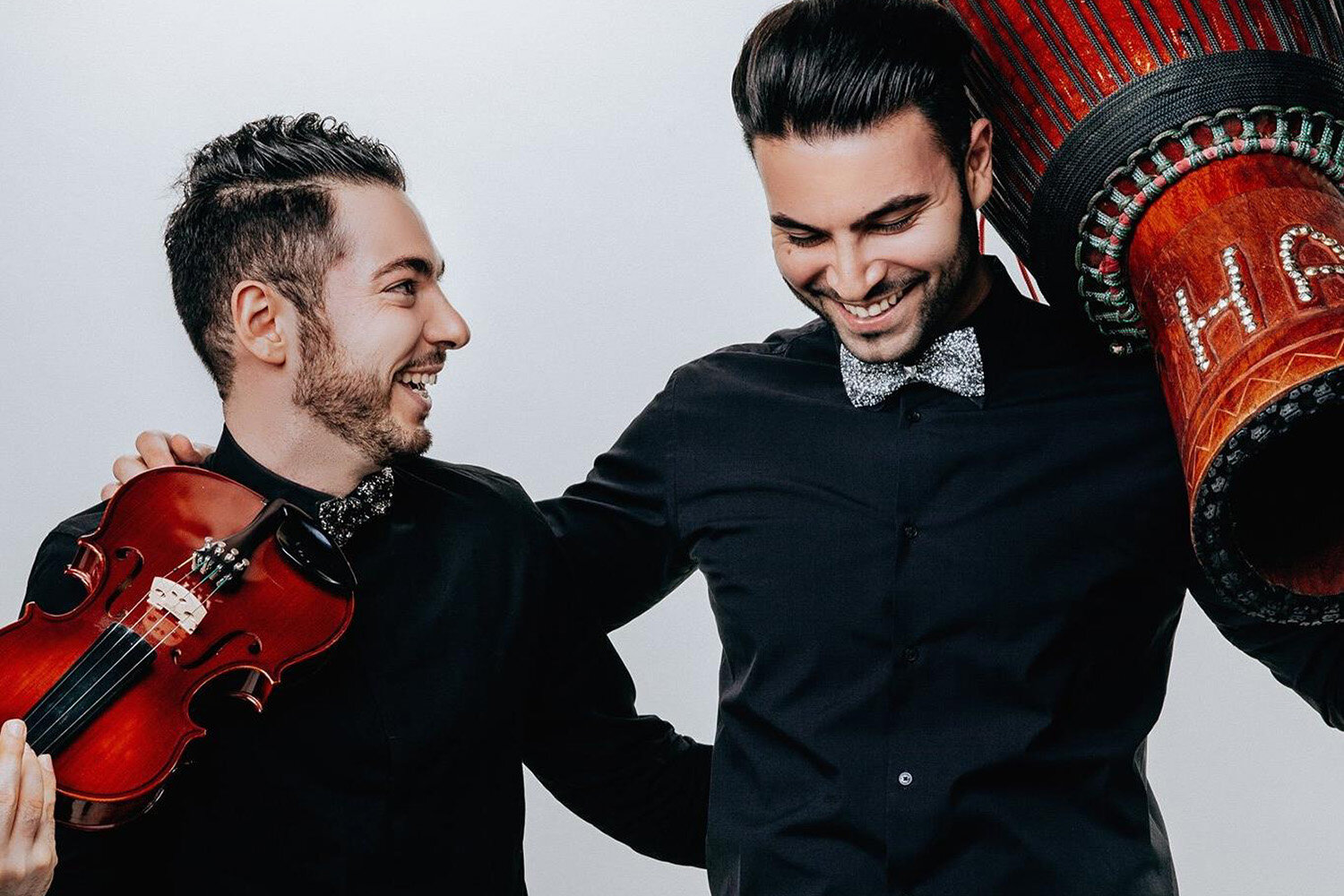 Together, this dynamic duo fuses their raw talents by mixing the electric violin and bongo.