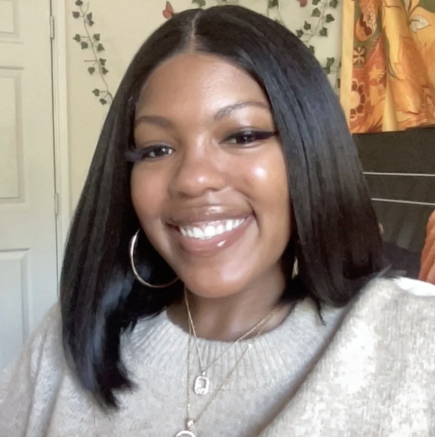 Mariah Chapman, Office Administrator, smiling in a cream knit sweater