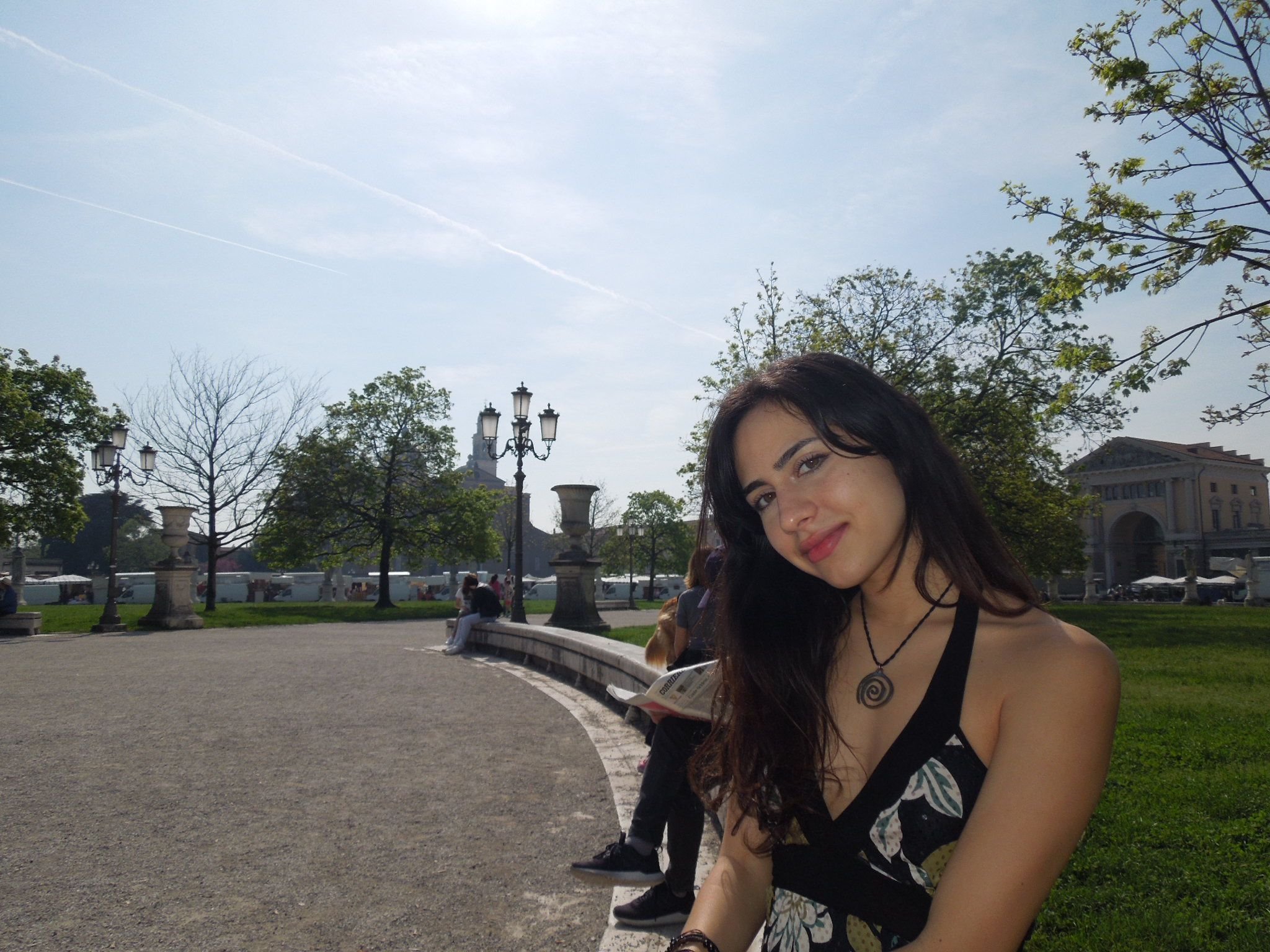 Jessica Taghizadeh, Office Administrator, smiling outdoors in a park