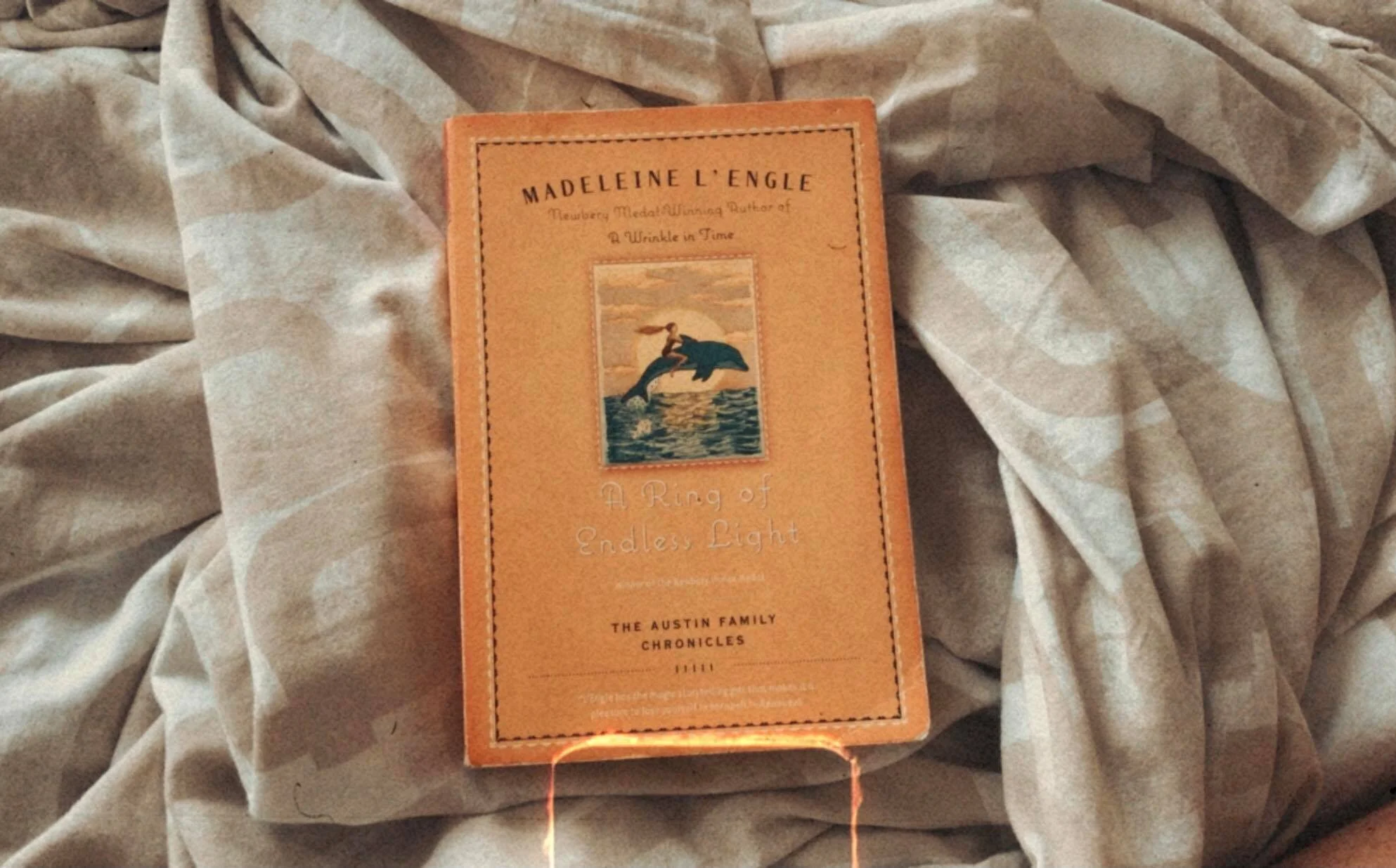 I’m rereading one of my favorite books, A Ring of Endless Light by Madeleine L’Engle, for the third time.