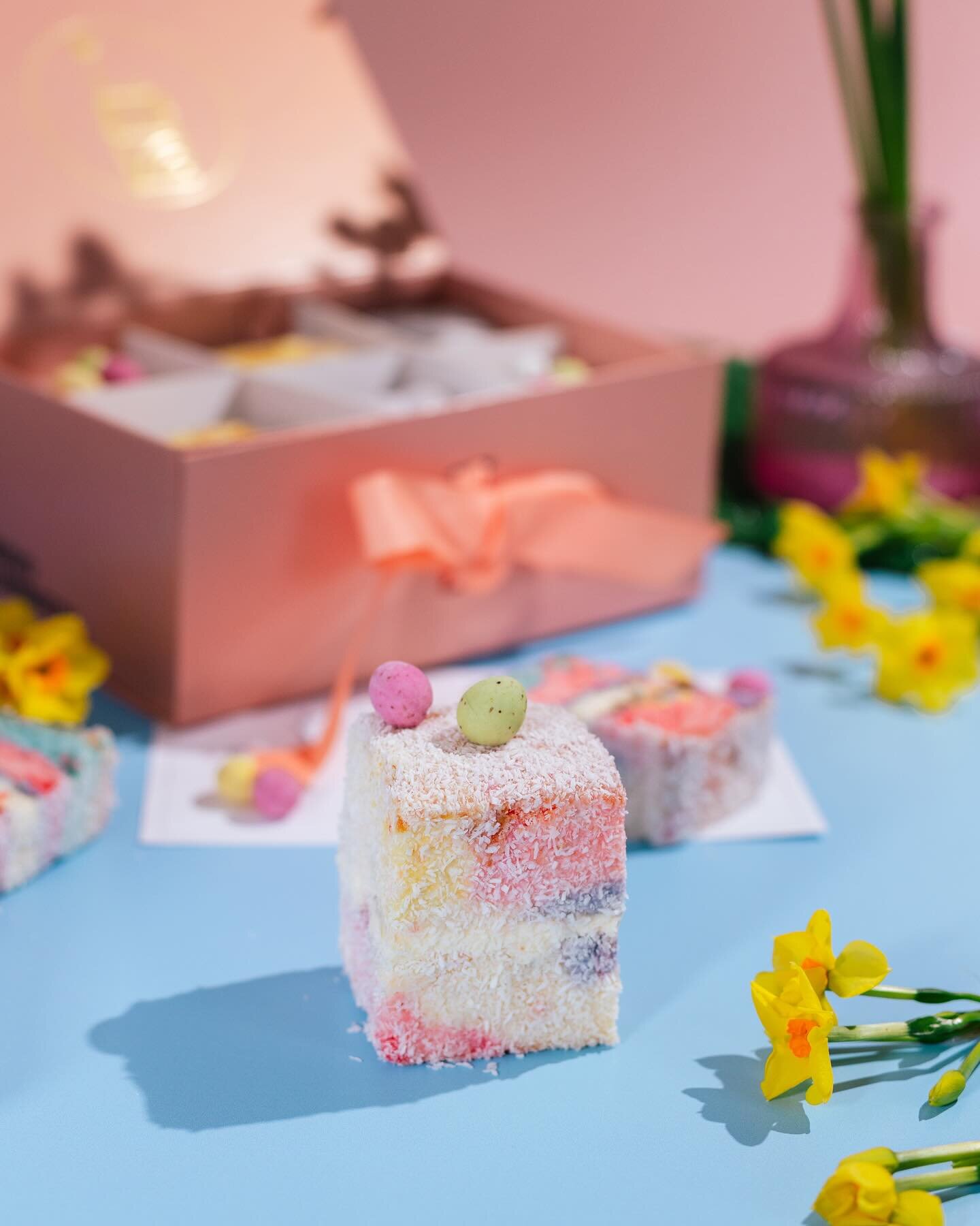 🐰 EASTER Lamington Box is now AVAILABLE! Order now on Deliveroo.

Featuring three of our favourite flavors:

🌈 2x Rainbow with Mini Eggs: Indulge in the vibrant colours and sweet goodness, topped with delightful mini eggs for an extra Easter treat!