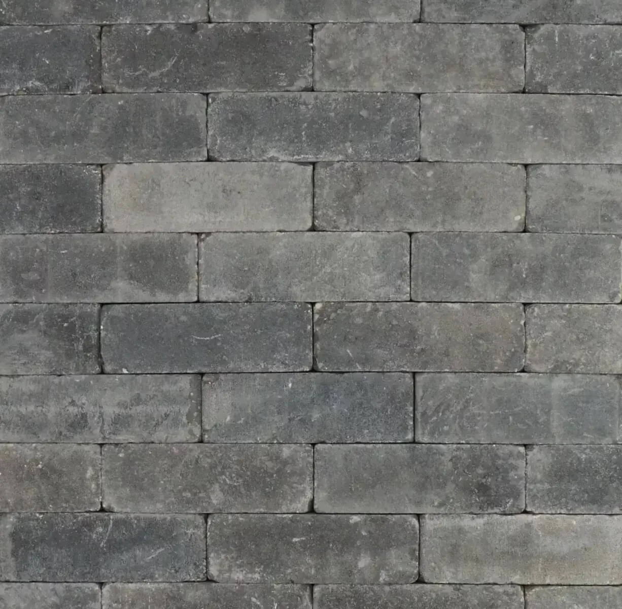 Trommelsteen grijszwart genuanceerd