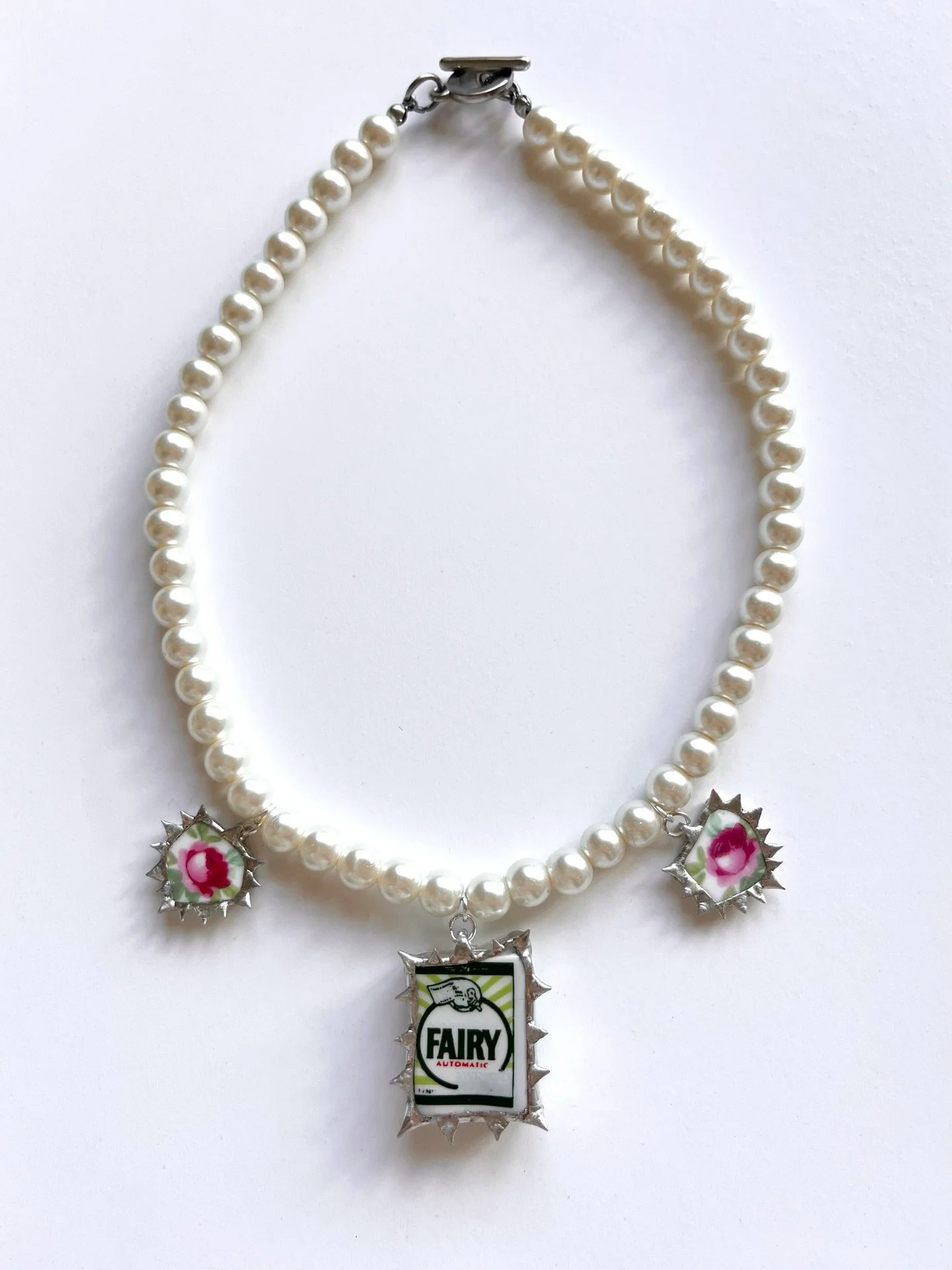 Fairy Rose charm necklace 🫧🧚🏻- made from a dolls house miniature and one of my Grandma&rsquo;s teacups. On a vintage pearl bead necklace. 

#dollshouseminiatures #charmnecklace