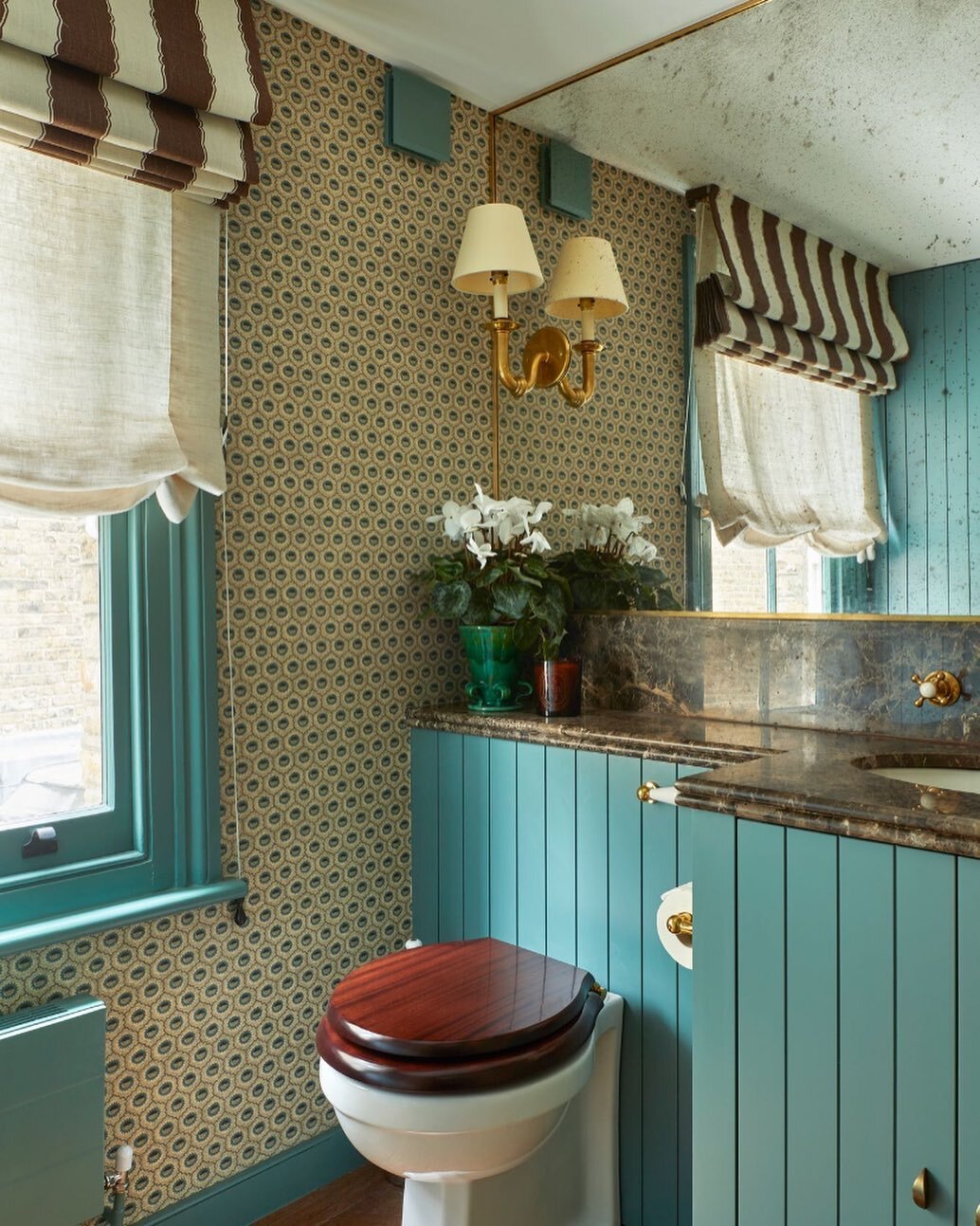 Cloakroom from a recent project. We clad the walls in antique mirror to maximise the tight space and used marron imperial with a favourite @robertkime wallpaper 
.
.
.
#interiordesign #cloakroom #wallpaper #marble #antiquemirror #isabellaworsley 📸 @