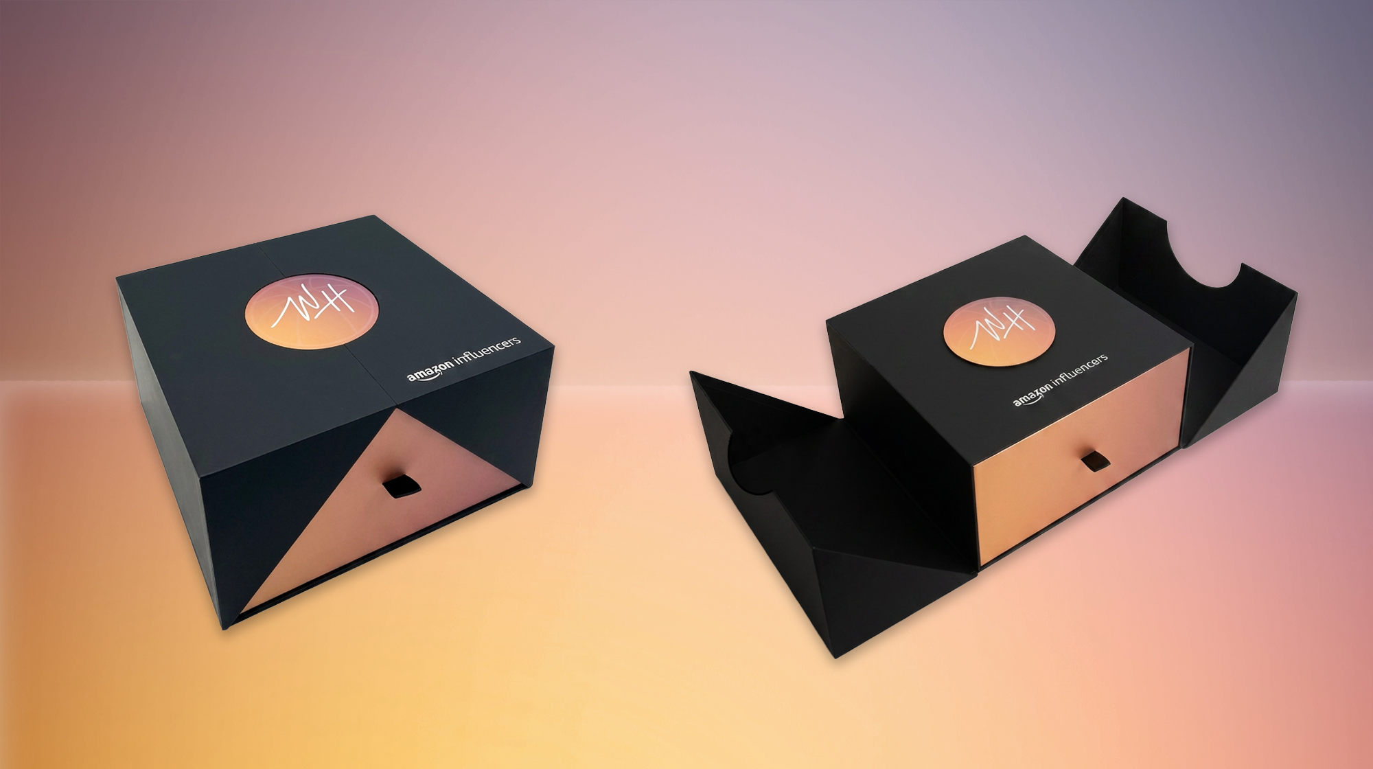 Two black boxes with rose gold accents and a circular logo on the top read "HIT". One box is closed, the other is open showing a black interior. Both boxes have the words "amazon influencers" written on the side. influencer bespoke boxes packaging 