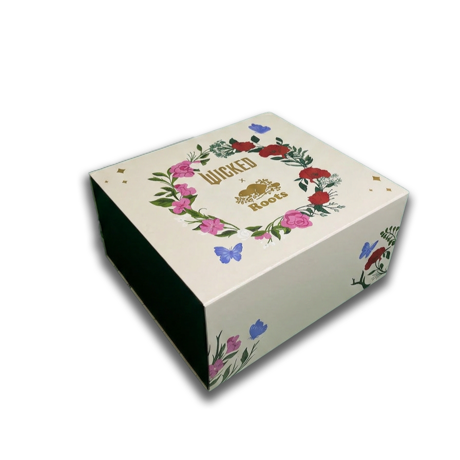 A decorative gift box with floral designs and the words 'WICKED Roots' on the top.  influencer boxes A&H packaging