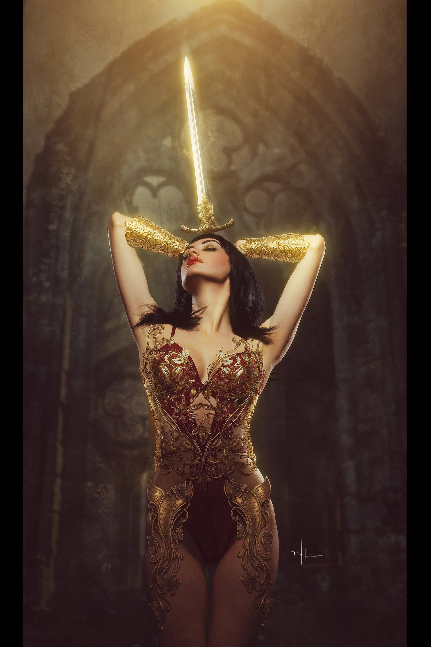 A woman with long dark hair and makeup poses with her hands behind her head, wearing intricate gold and red clothing and gloves. A sword is floating vertically above her head, with a glowing light. The background is an arched stone interior with goth