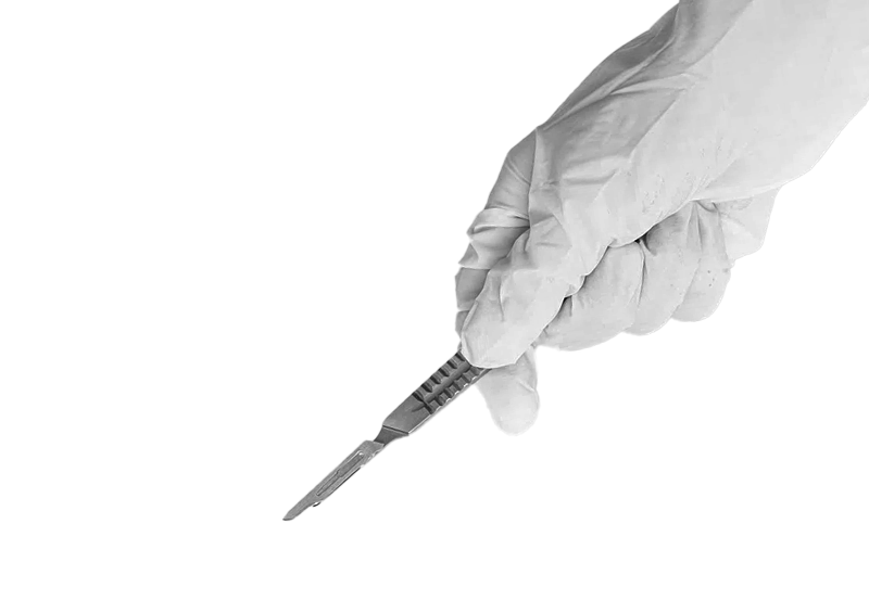 A hand wearing a white medical glove holding a scalpel over a gray surface.