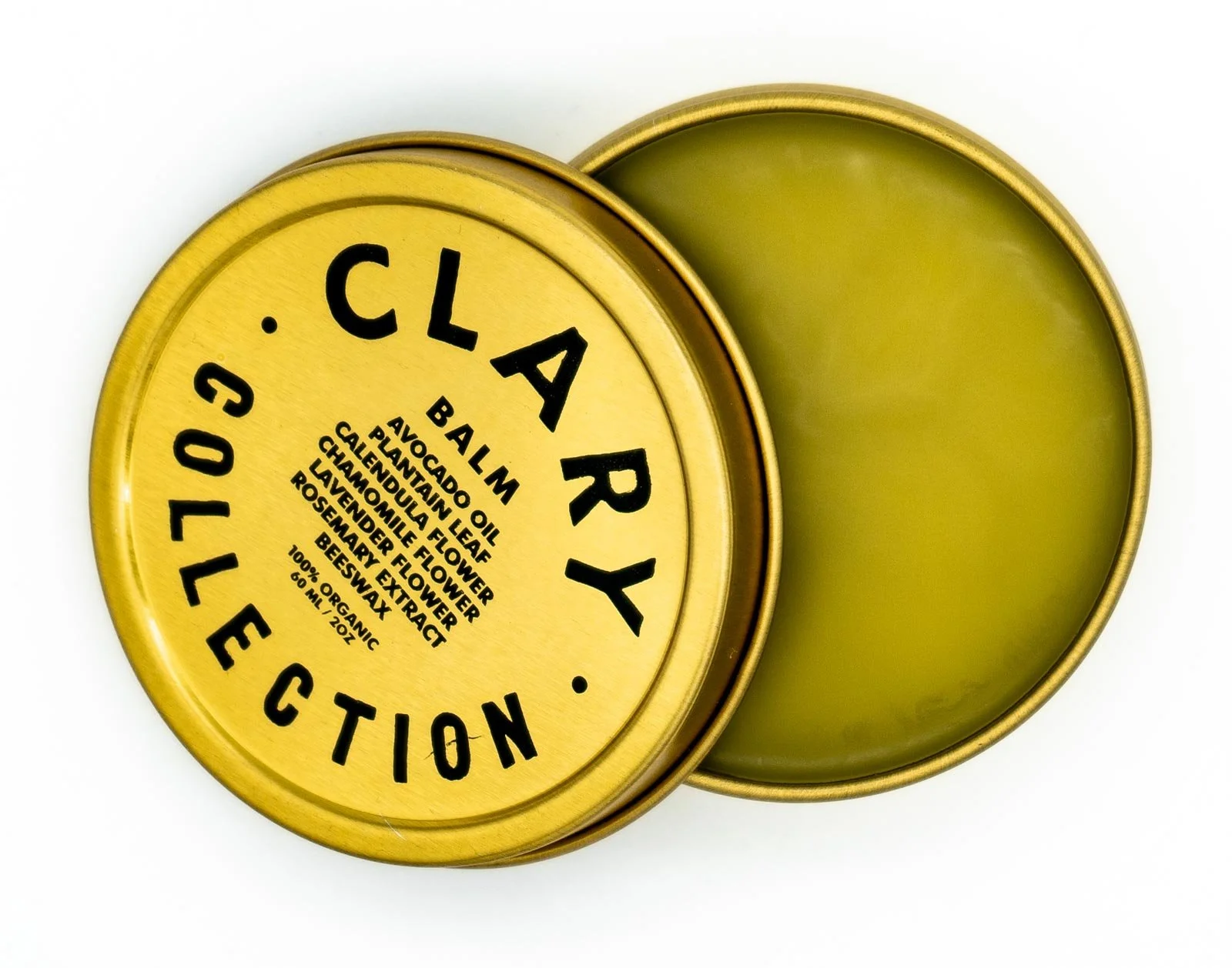 Yellow tin of herbal balm with a green lid beside it, labeled 'Clary' with ingredients including balm, avocado oil, plantain leaf, calendula flower, chamomile flower, lavender flower, rosemary extract, beeswax, and organic ingredients.