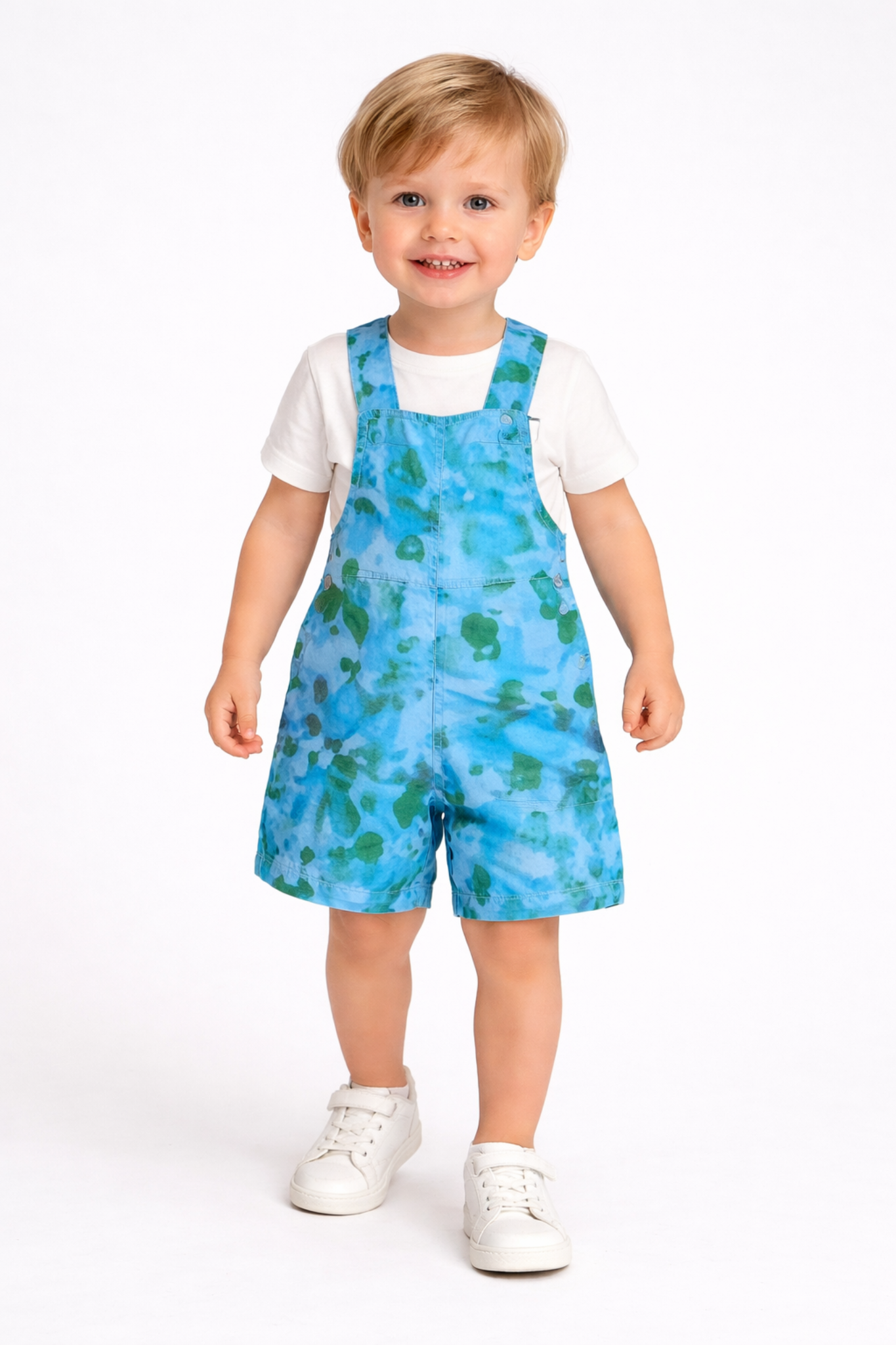 Cheerful toddler in Pera Fabrics  overalls_2.png