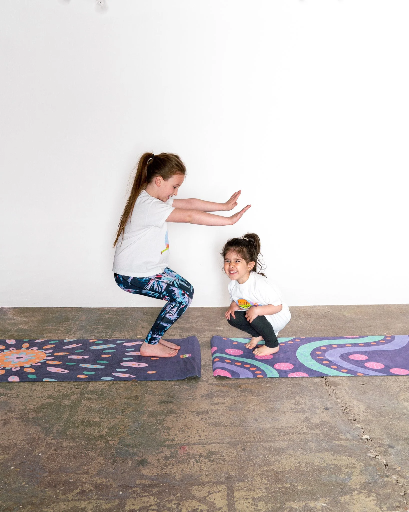 Children practising yoga poses during a kids yoga class
