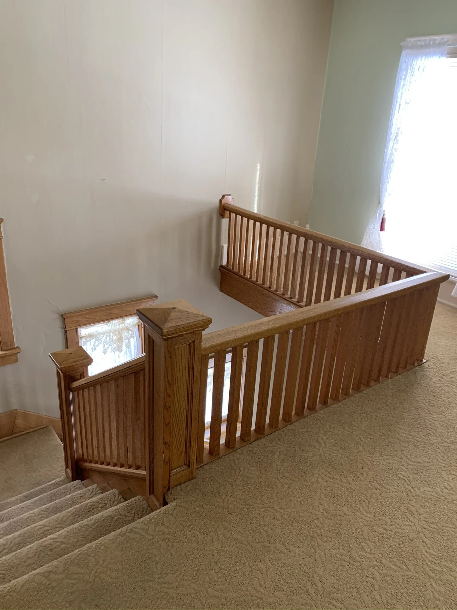 The original newel post had a single section and supported the handrail at just 19" hight.