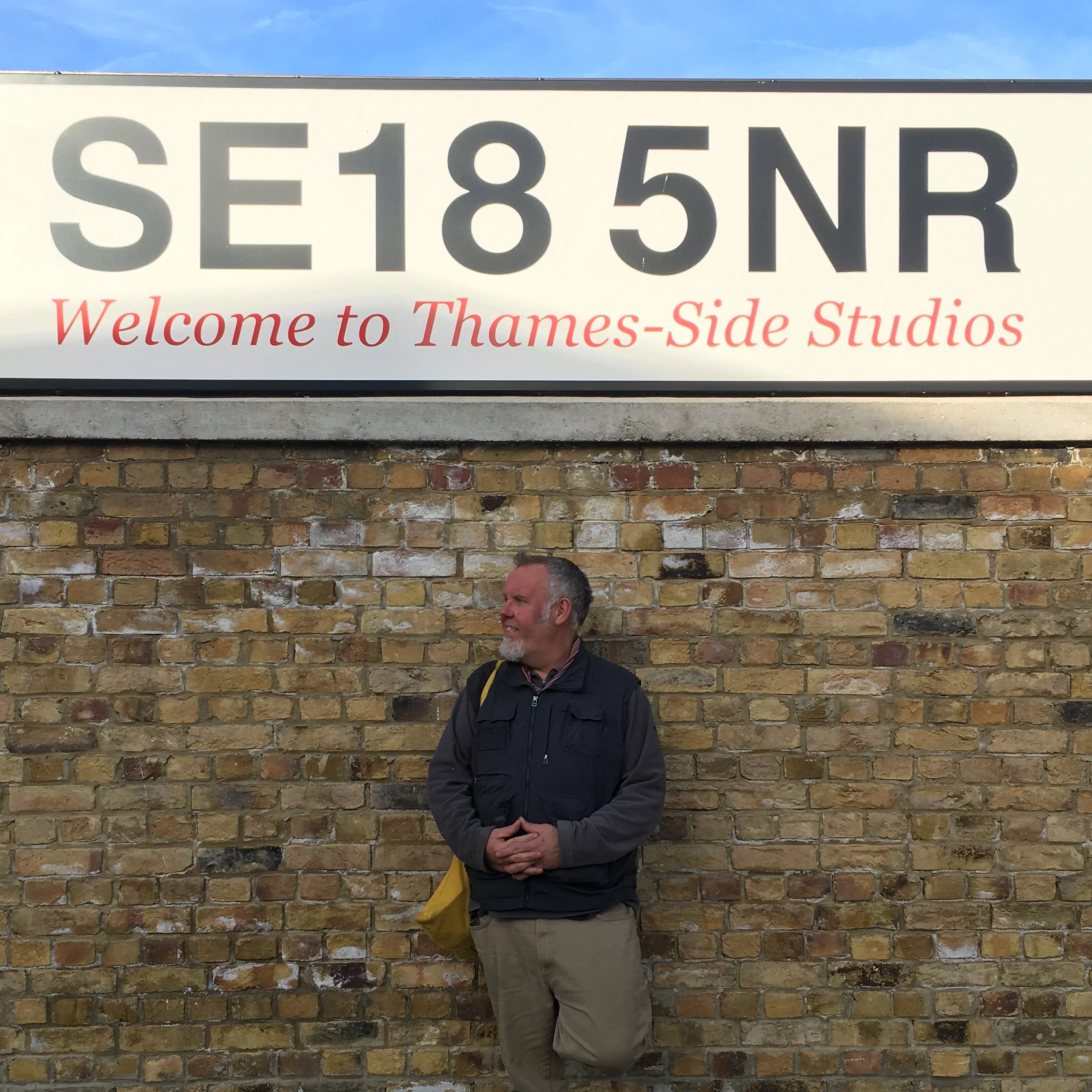 Founder Stephen Stockbridge in front of the Thames-Side Studios SE18 5NR sign