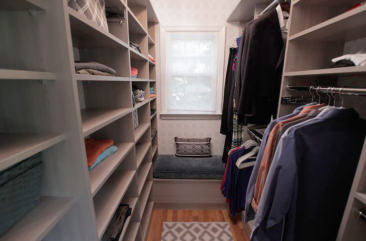  Bridget and Tom’s custom walk-in closet with shelves, hanging, and bench. 