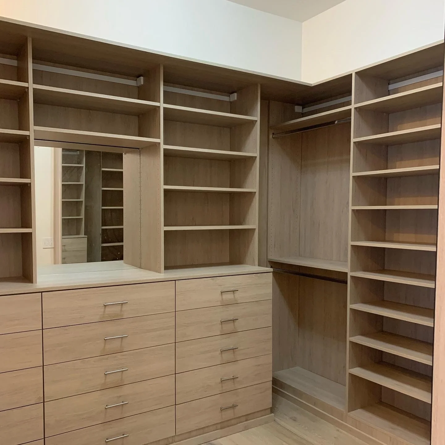 walk-in closet, wood color, adjustable shelves, drawers, hanging space