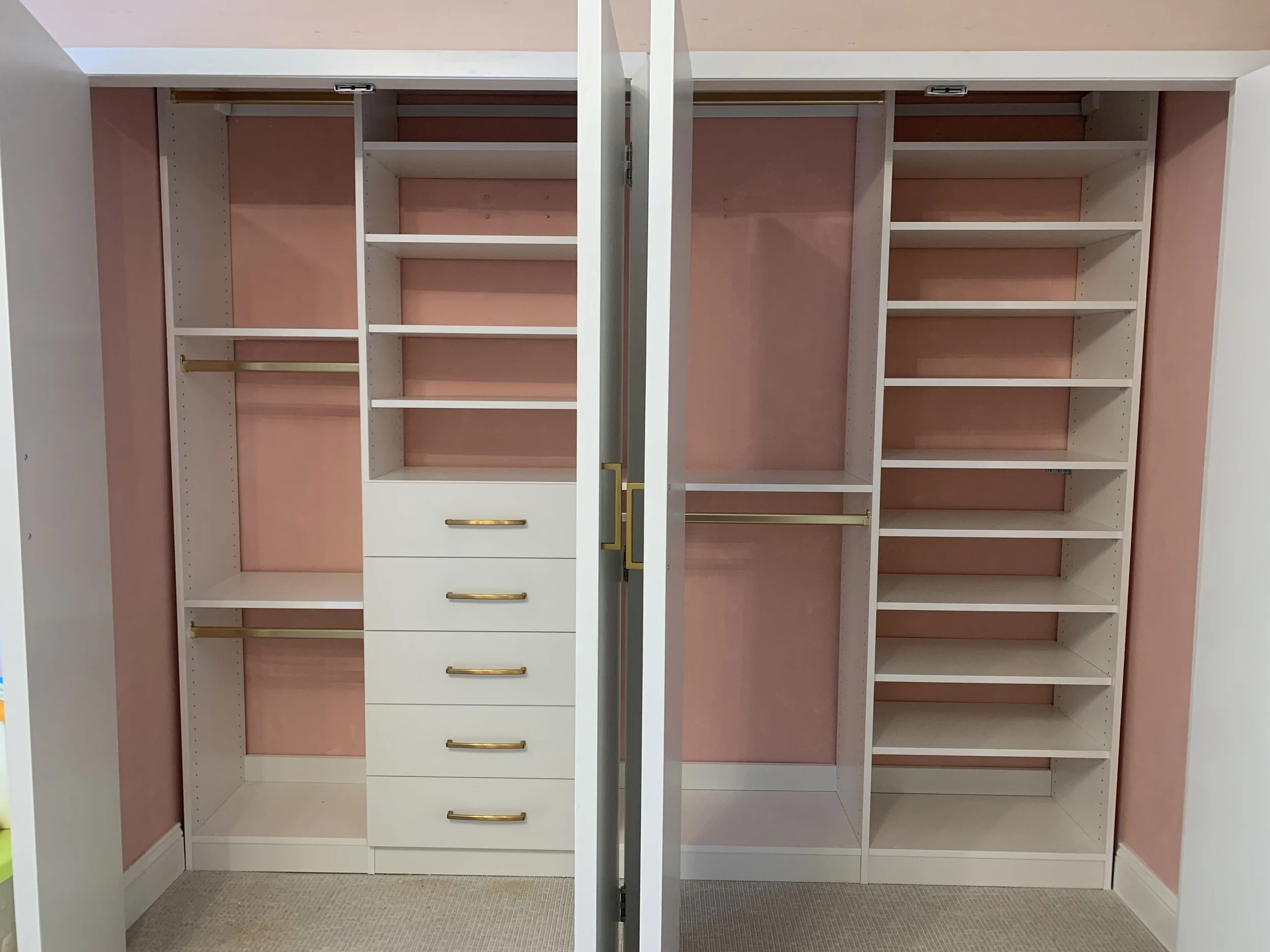 reach in closet with shelves and drawers and double hanging