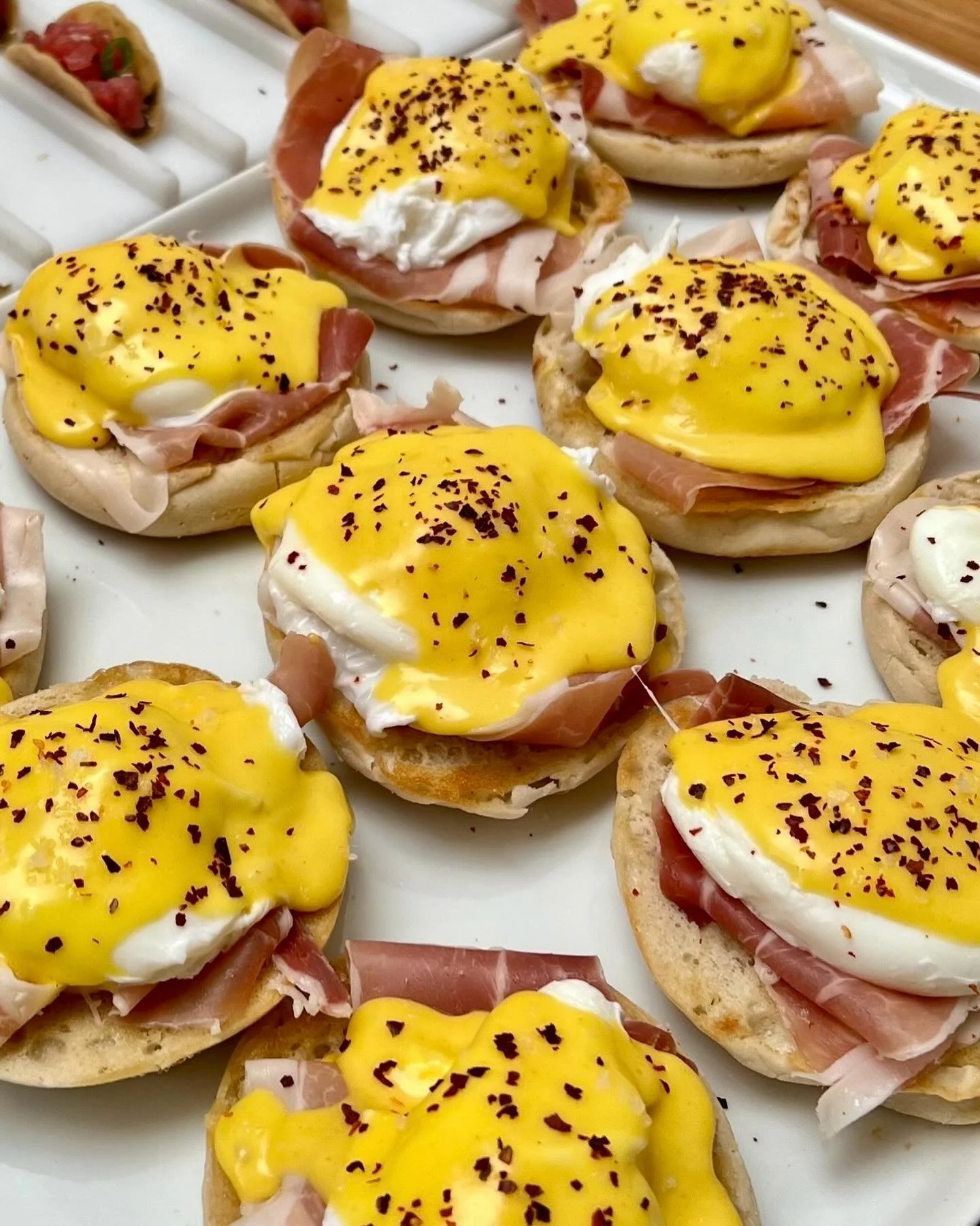 Eggs Benny 🍳 New to our private event menus! English muffin layered with prosciutto, poached egg, hollandaise, and aleppo pepper. The perfect addition to your party menu 🎉