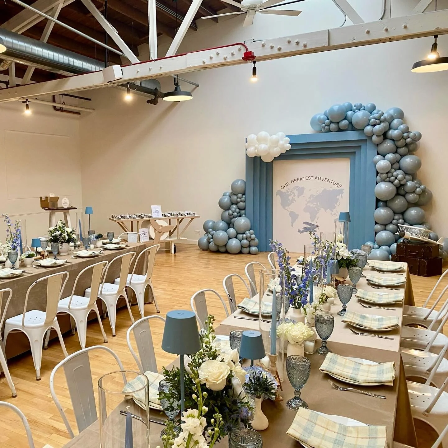The adventure begins! @limanidesigns transformed our event space into the dreamiest baby shower for Stephanie and Billy. Gorgeous blues, delicate textures, colored glassware, layered linens, and hot air balloon details made for a beautiful event! T&a