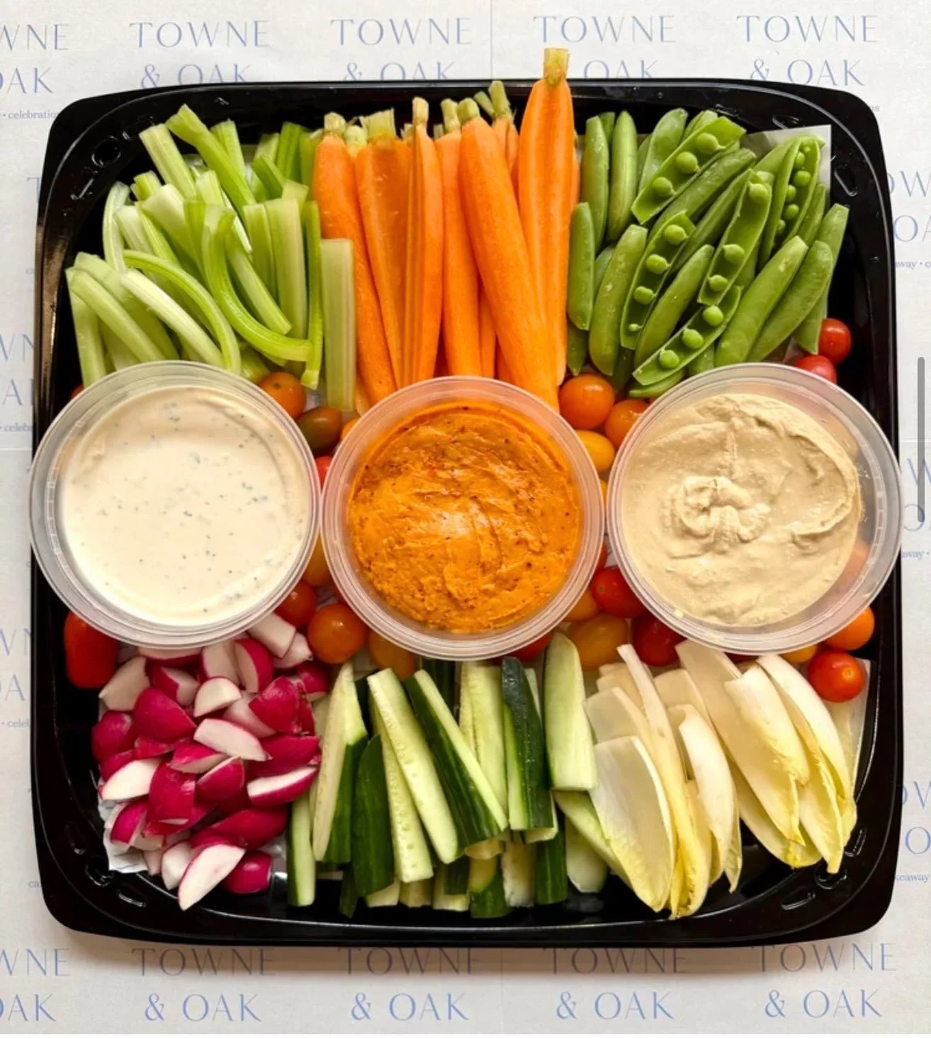 We have a new party platter on our catering menu: The&nbsp;T&amp;O Trio - our take on a crudit&eacute; platter with housemade hummus, pimento cheese, and ranch served with fresh vegetables for dipping 🥕🥒 Click the link in bio to place your catering