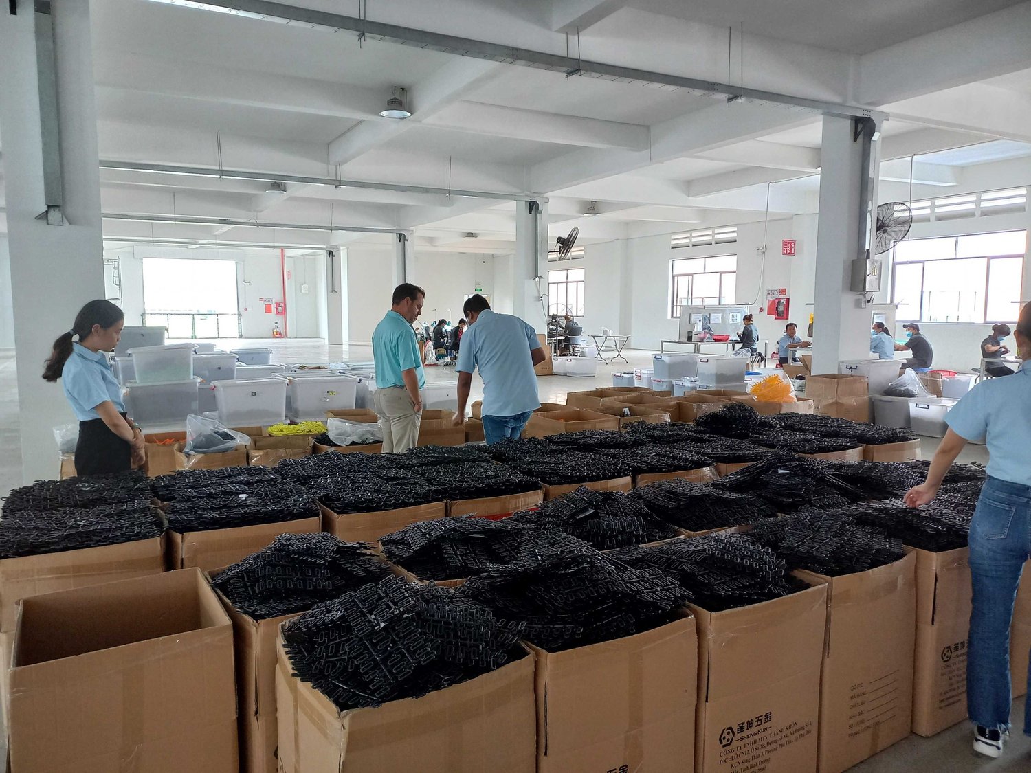 Cosmo Sourcing client visiting a plastic factory in Vietnam during a sourcing trip