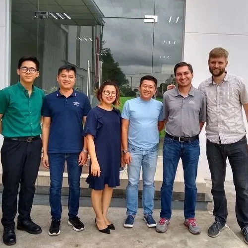 Team and client on a factory visit