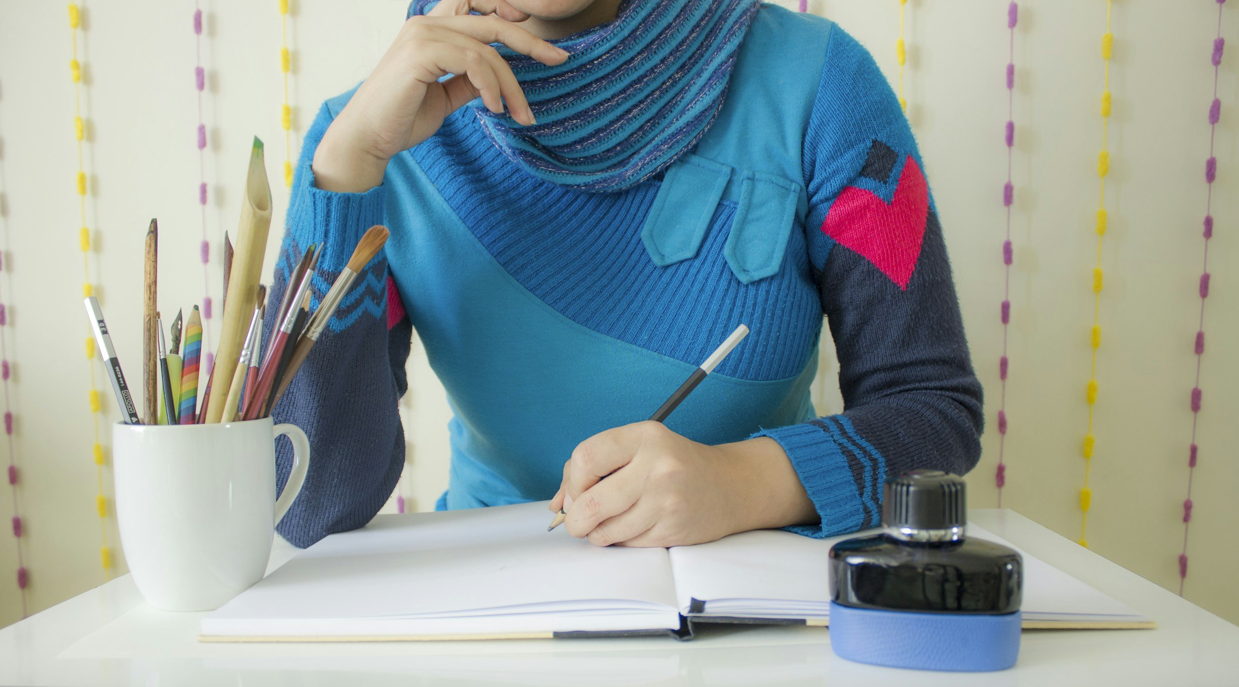 woman writing in notebook