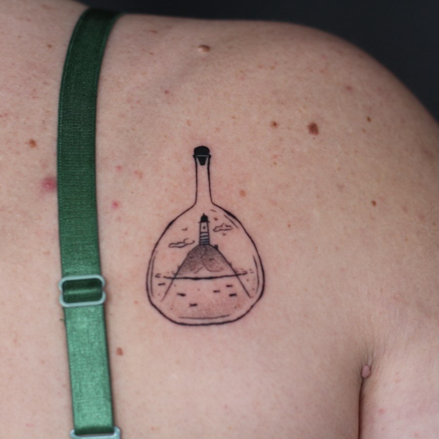 I think i&rsquo;ll make more in a bottle flash pieces because this came out so cute!!! 

Done at @obscura.tattoo 
Supplied by @anarchy_tattoo_supplies 

#lighthousetattoo #illustrativetattoos #blackandgreytattoo #tattooartists #tattoo