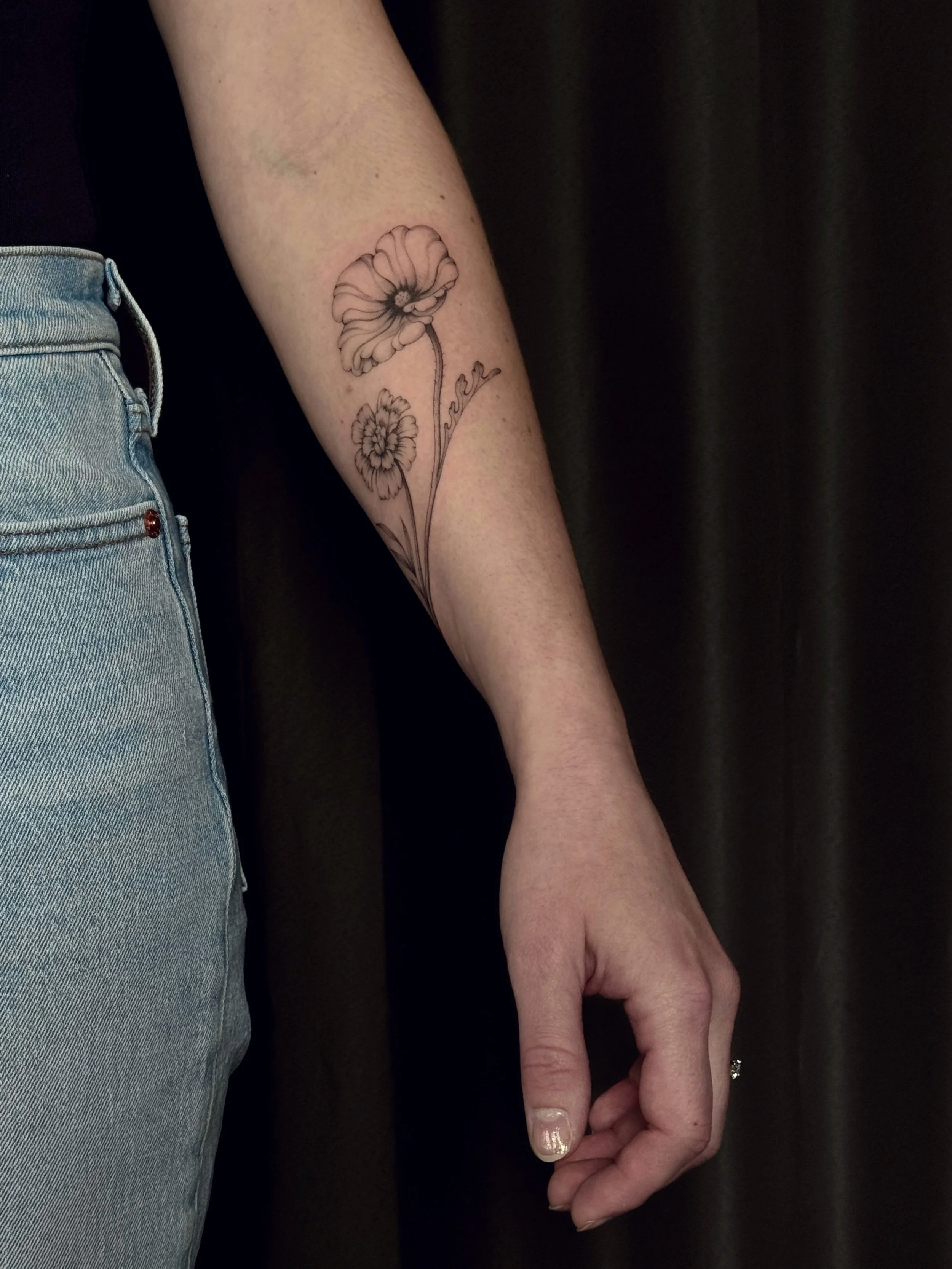 Poppy and Marigold birth month flowers for Melanie 💕
~
Melanie was looking for a botanical piece, each flower representing the birth months of her children. She had wanted the piece on her forearm; this is a beautiful spot for a botanical piece as t