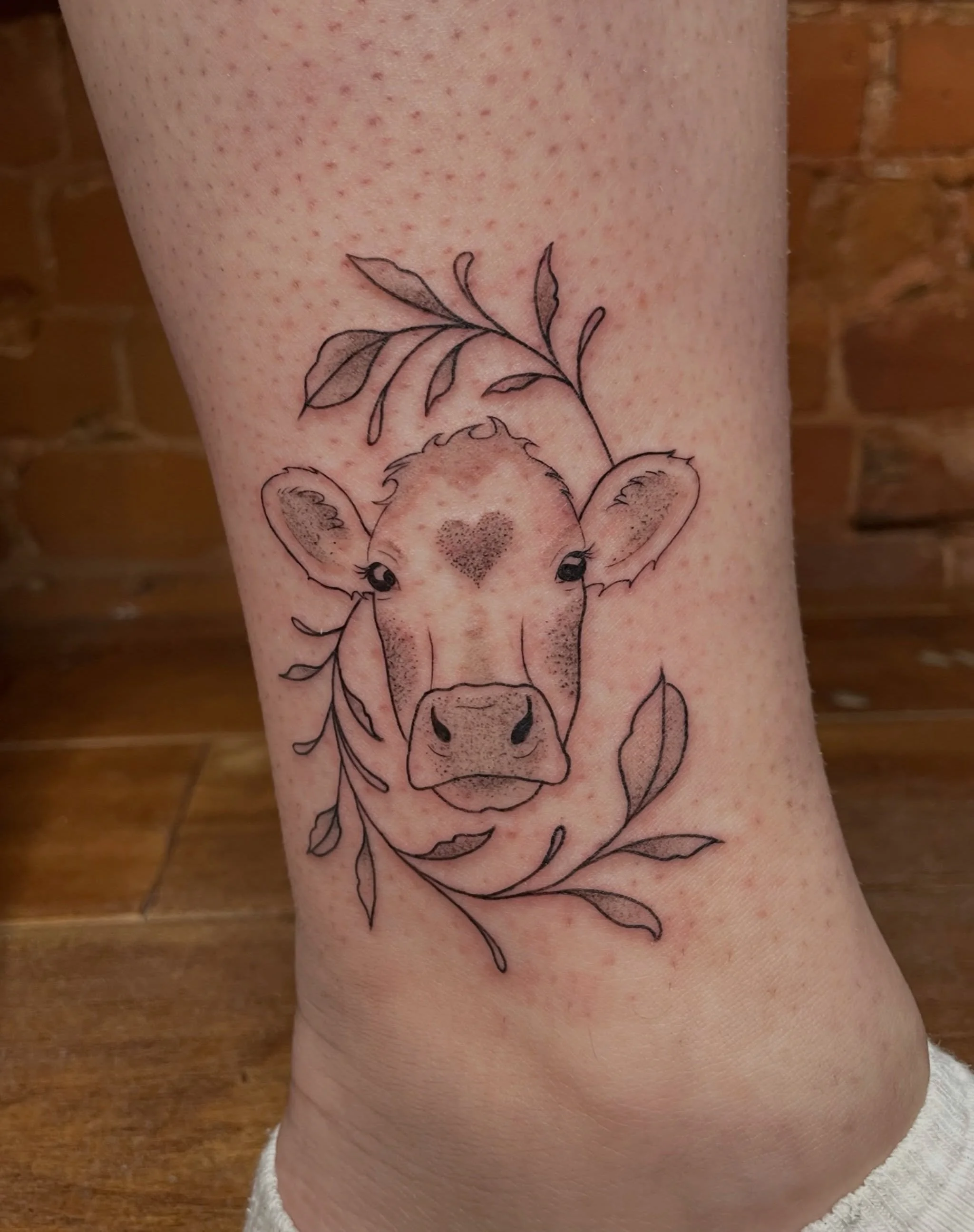 Adorable Little Cow by @tattoosbyabbeysmith 🐮🤍
.
.
.
Artist: @tattoosbyabbeysmith 
Studio: @obscura.tattoo 
.
.
.
#ottawatattoo #ottawaartist #obscuratattoo #finelinetattoo #cowtattoo