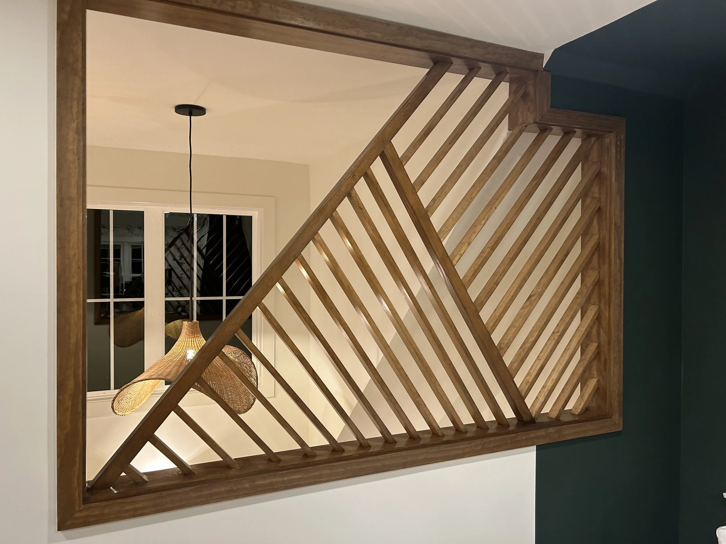 Wooden geometric window design in above-garage apartment in Plaza Midwood