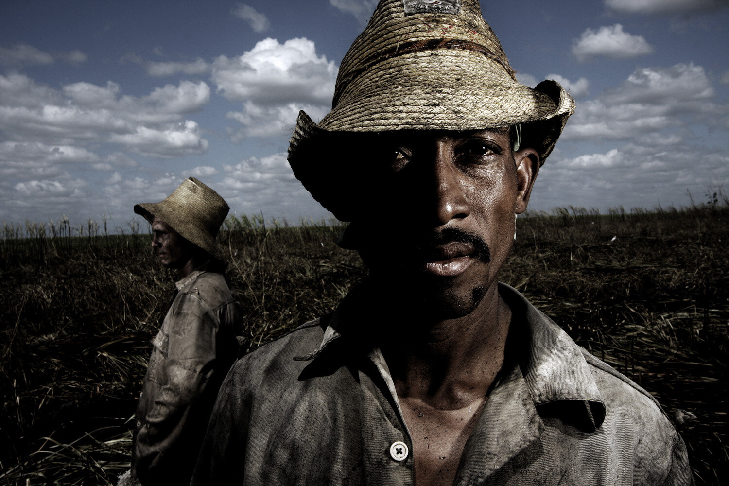  Vicente, 32, (front) and Daniel, 22, sugarcane cutter, pose for a potrait. Both men have been working for 4 years in the sugarcane industry.  