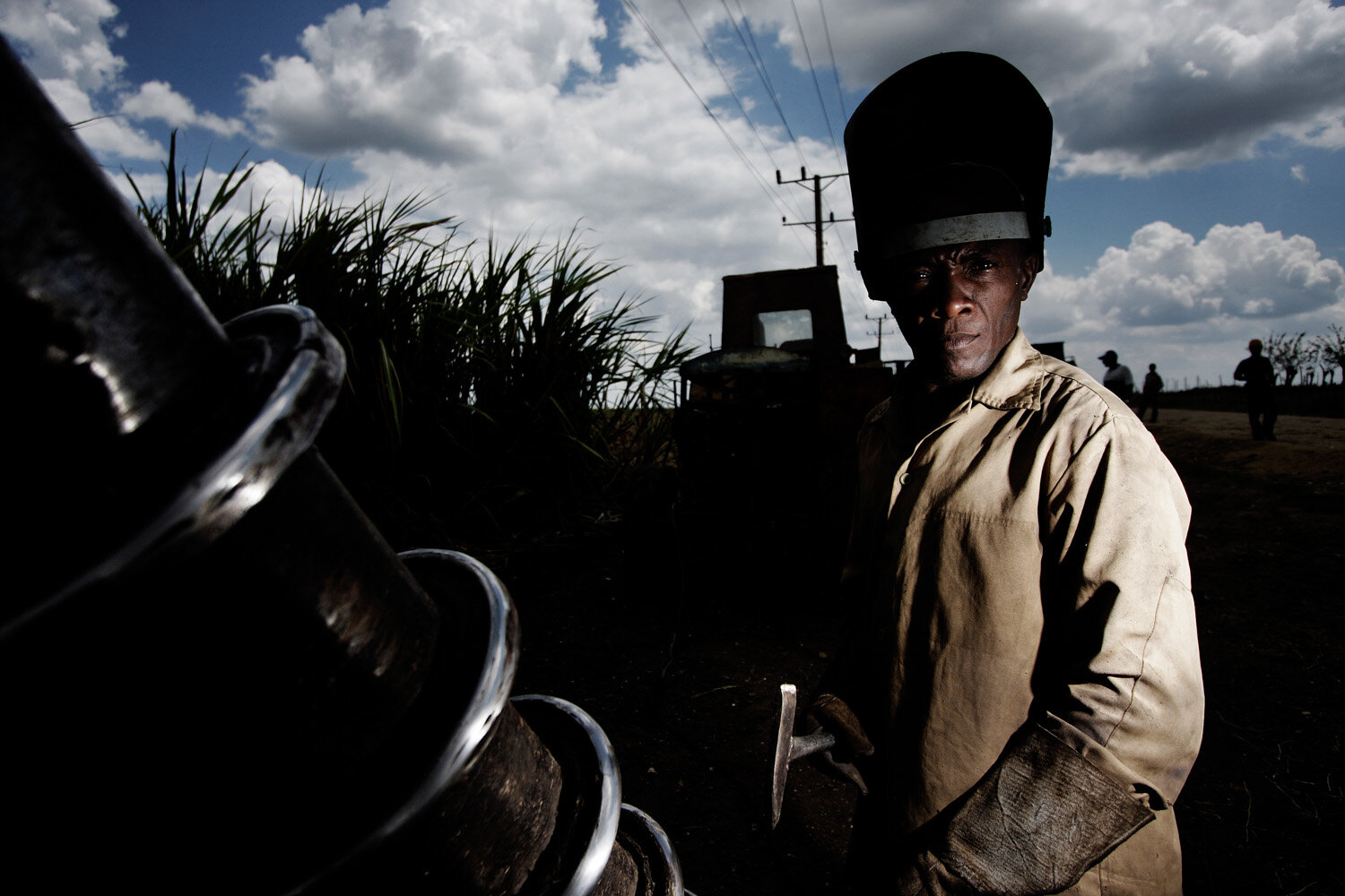  Pedro, 47, welder, gets ready to weld a harvester. Pedro has been working for 12 years  in the sugarcane industry.  