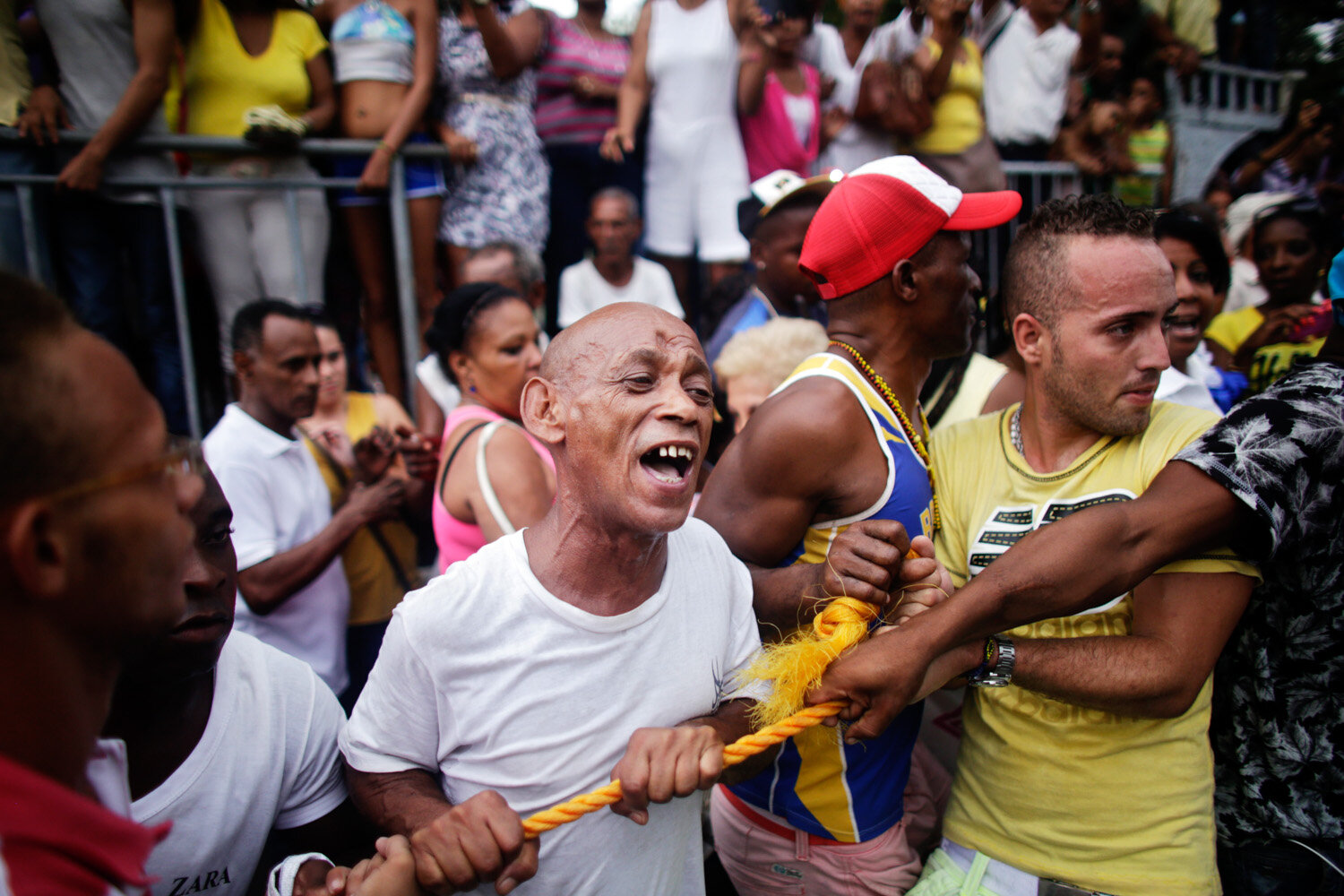  Cubans help securing a procession for Cuba’s patron saint Virgen de la Caridad de Cobre (Our Lady of Charity) , 2015                     