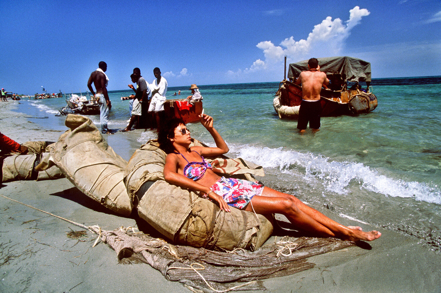  A young Cuban and others wait for the tide to allow the rafts to leave. 