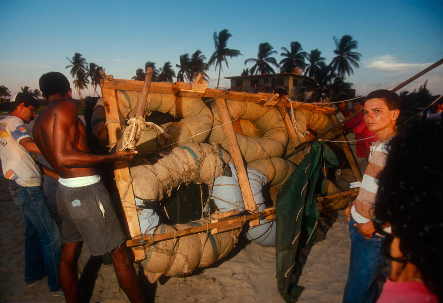  Cubans carry a makeshift raft to the Cojimar beach.  