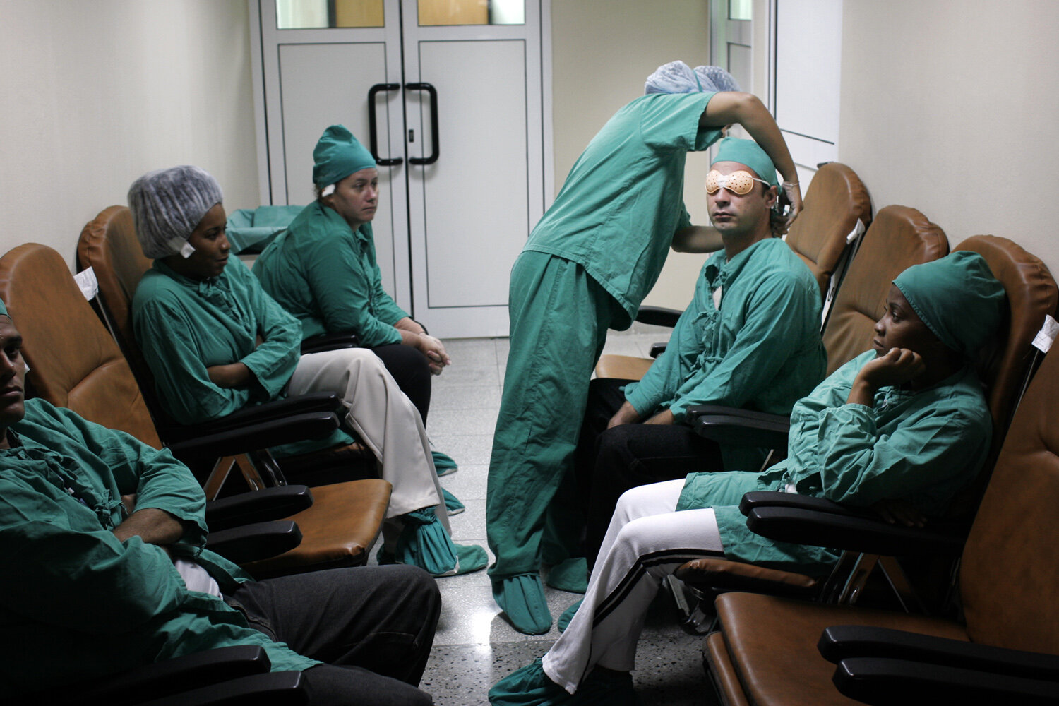  A Cuban nurse prepares a patient for eye surgery, hospital Pando Ferrer, "La Ceguera". 