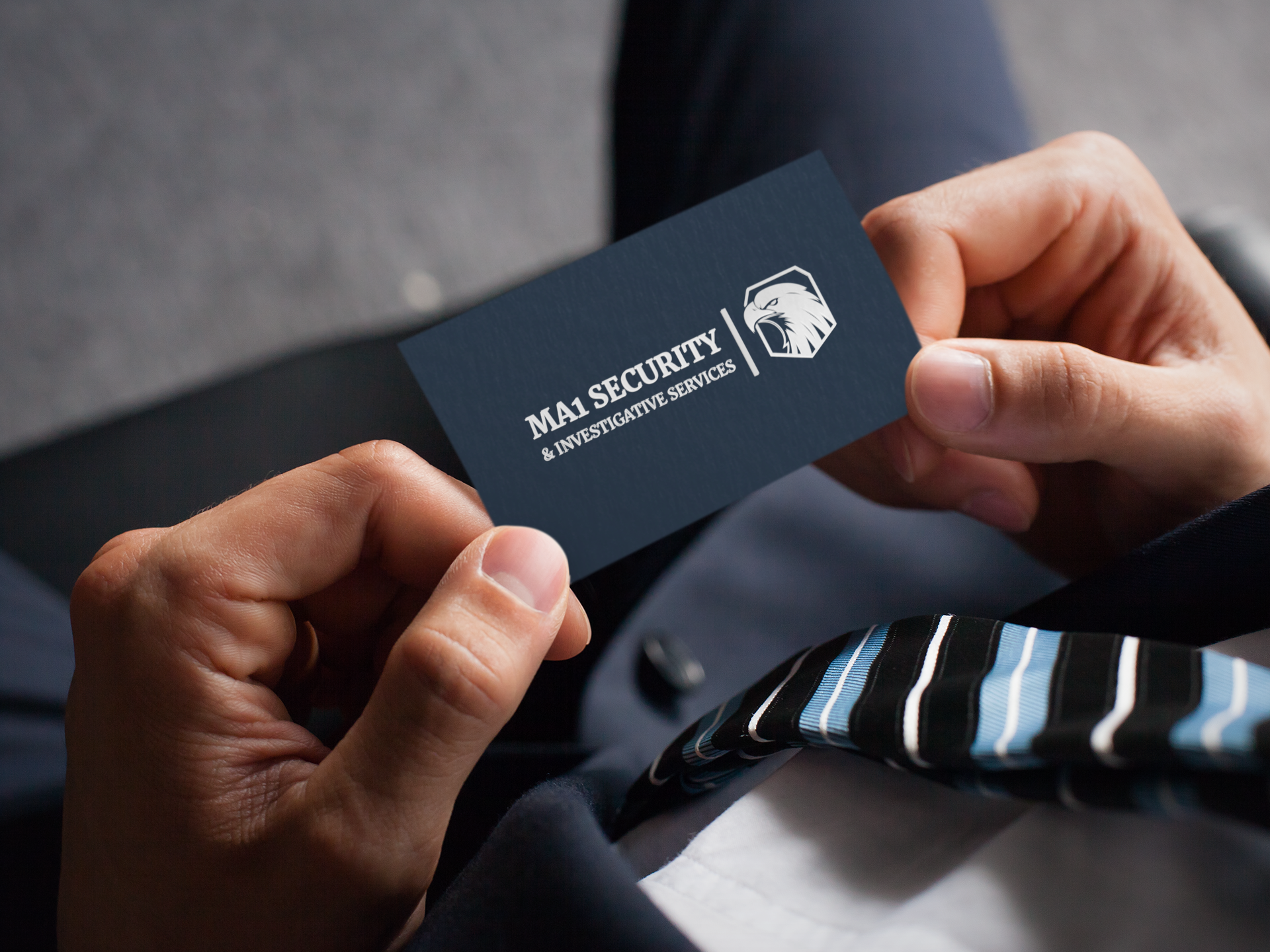 mockup-of-a-man-holding-a-business-card-with-an-embossed-texture-33770-2.png