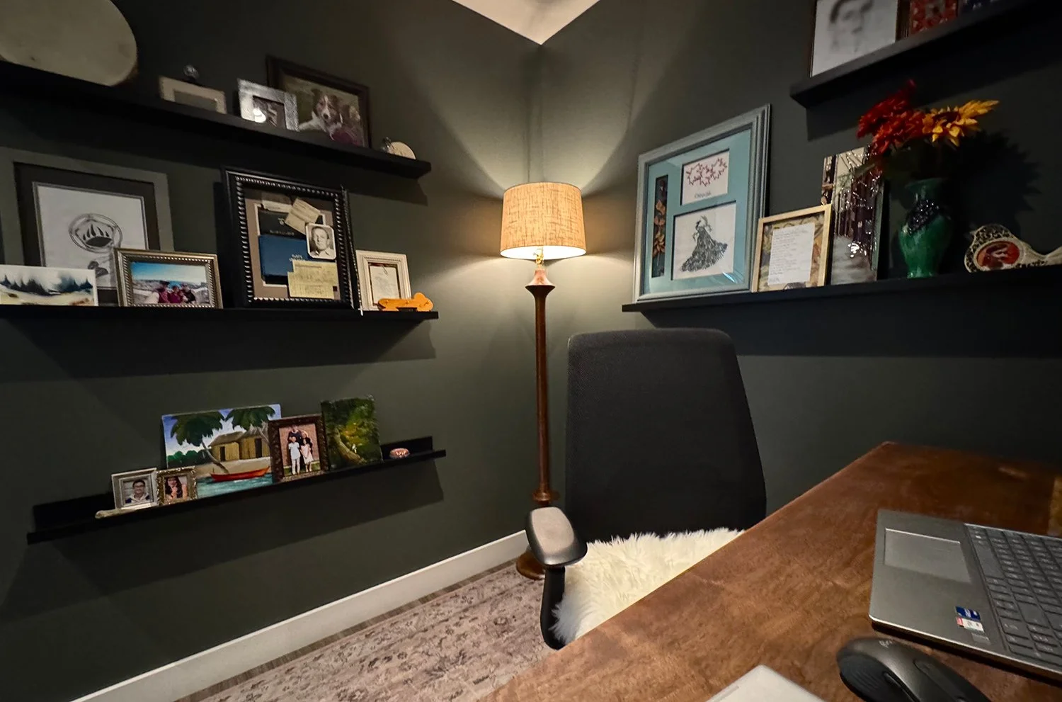 A cozy home office nook surrounded by personal treasures and meaningful keepsakes creates a comfortable workspace that inspires focus and joy