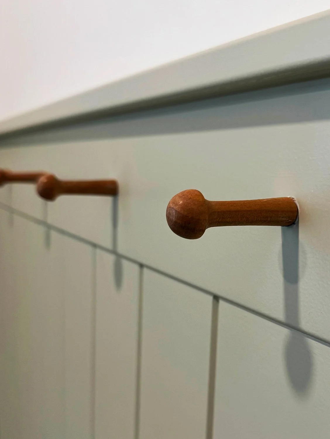 Kitchen renovation that honours the home’s 1912 Edwardian character while enhancing functionality for modern living. Every detail was thoughtfully considered, from the baker table, wooden coat hooks, to the thicker trim and window casings, and tradit