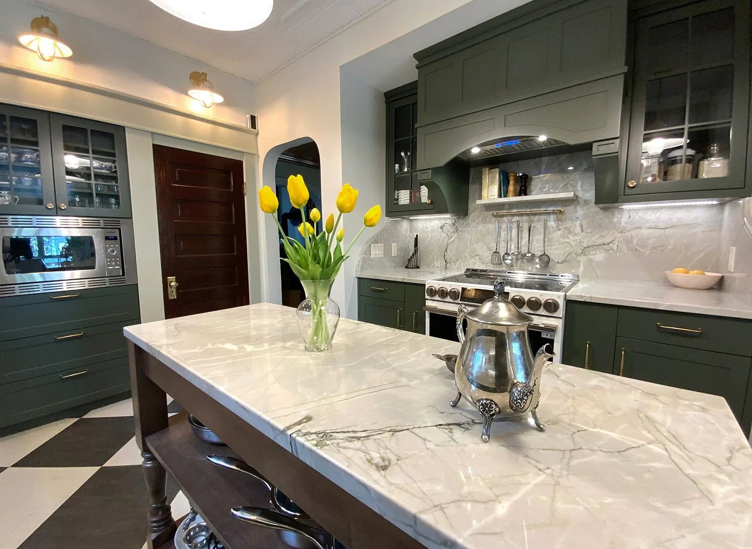 A kitchen renovation that honours the home’s 1912 Edwardian character while enhancing functionality for modern living. Every detail was thoughtfully considered, from the thicker trim and window casings to the Marmoleum checkerboard flooring and decor