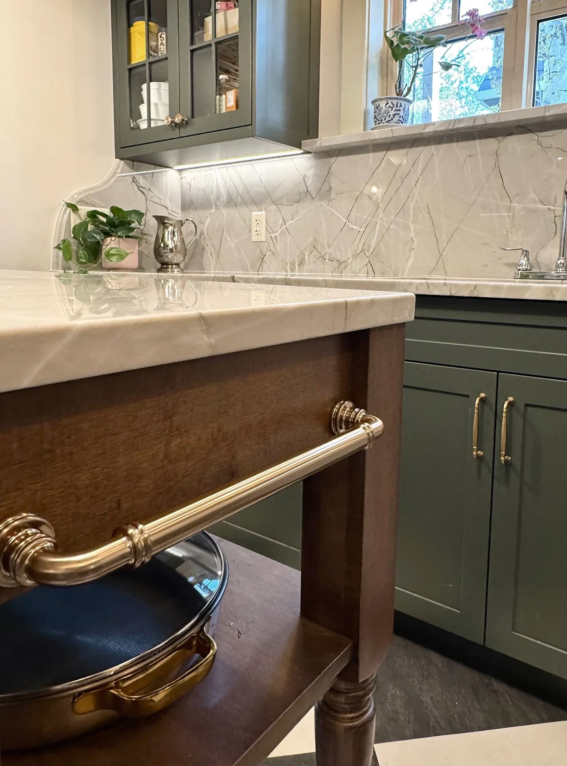 Kitchen renovation that honours the home’s 1912 Edwardian character while enhancing functionality for modern living. Every detail was thoughtfully considered, from the baker table, wooden coat hooks, to the thicker trim and window casings, and tradit