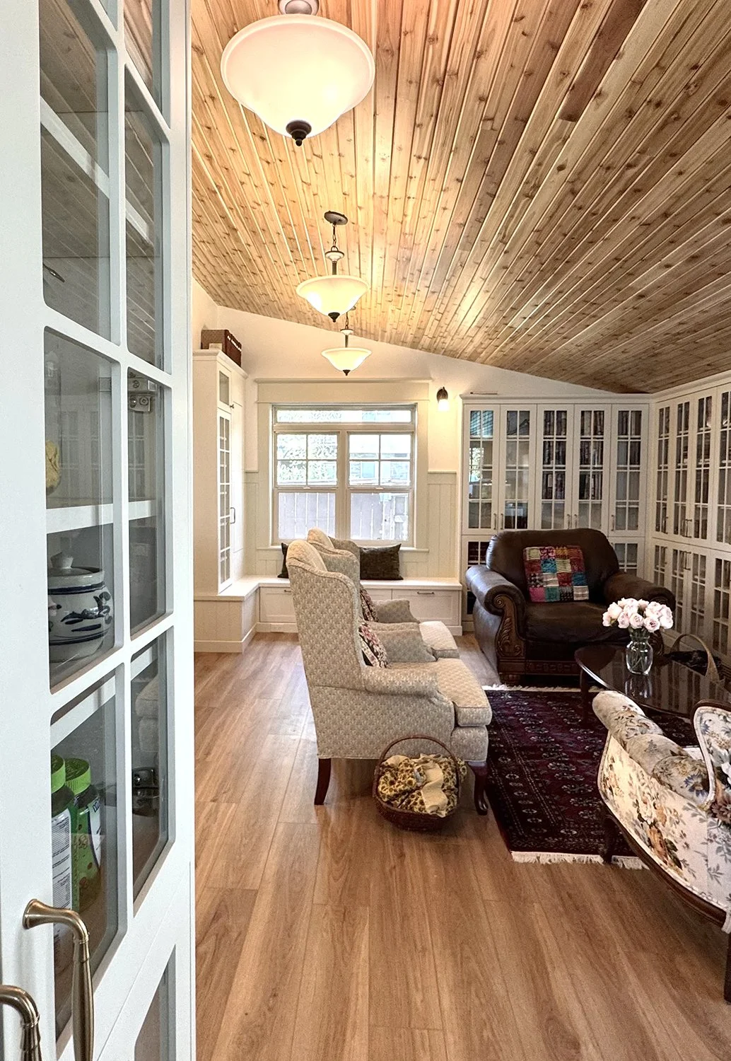 Family room renovation that honours the home’s 1912 Edwardian character while enhancing functionality for modern living. Every detail was thoughtfully considered, from the thicker trim and window casings to traditional wainscoting. 
