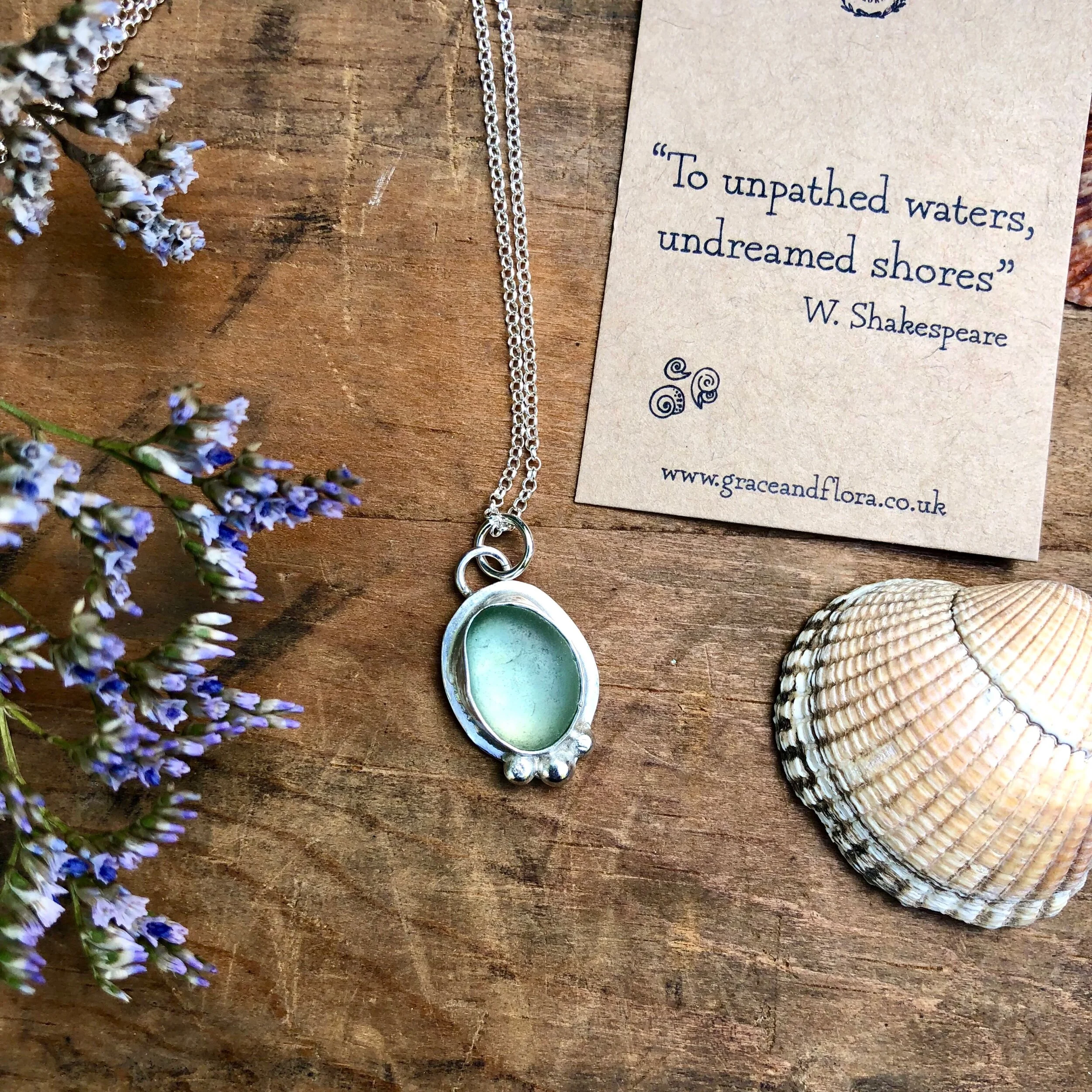 sea glass necklace - aqua blue oval with bobbles in silver. Handmade jewellery uk