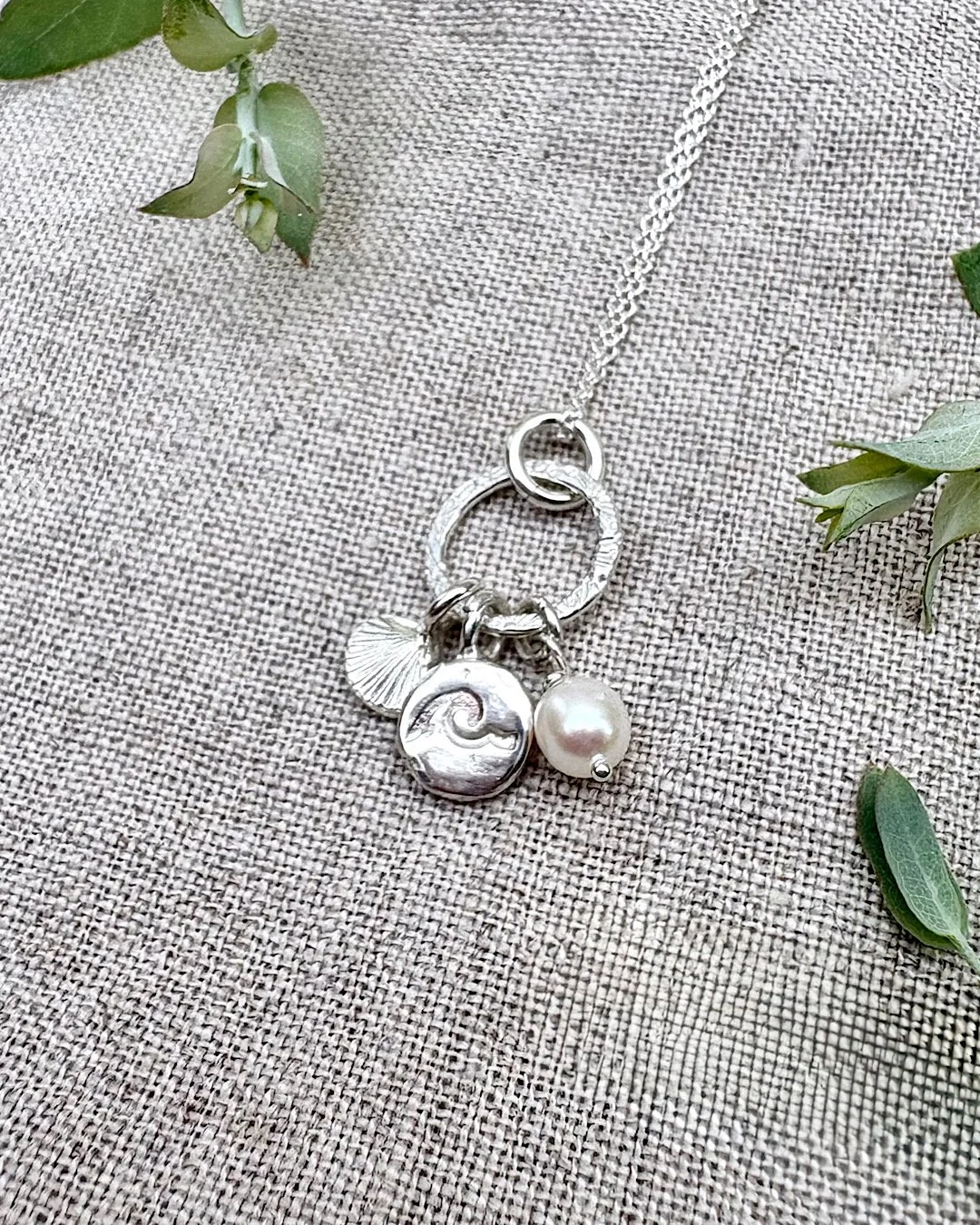Silver Shell and Wave Necklace: Coastal Echoes