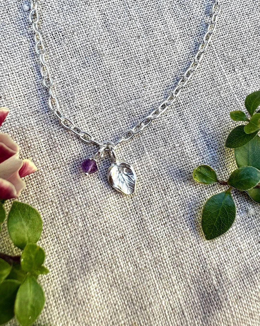 silver-charm-bracelet-with-leaf-and-birthstone.jpg