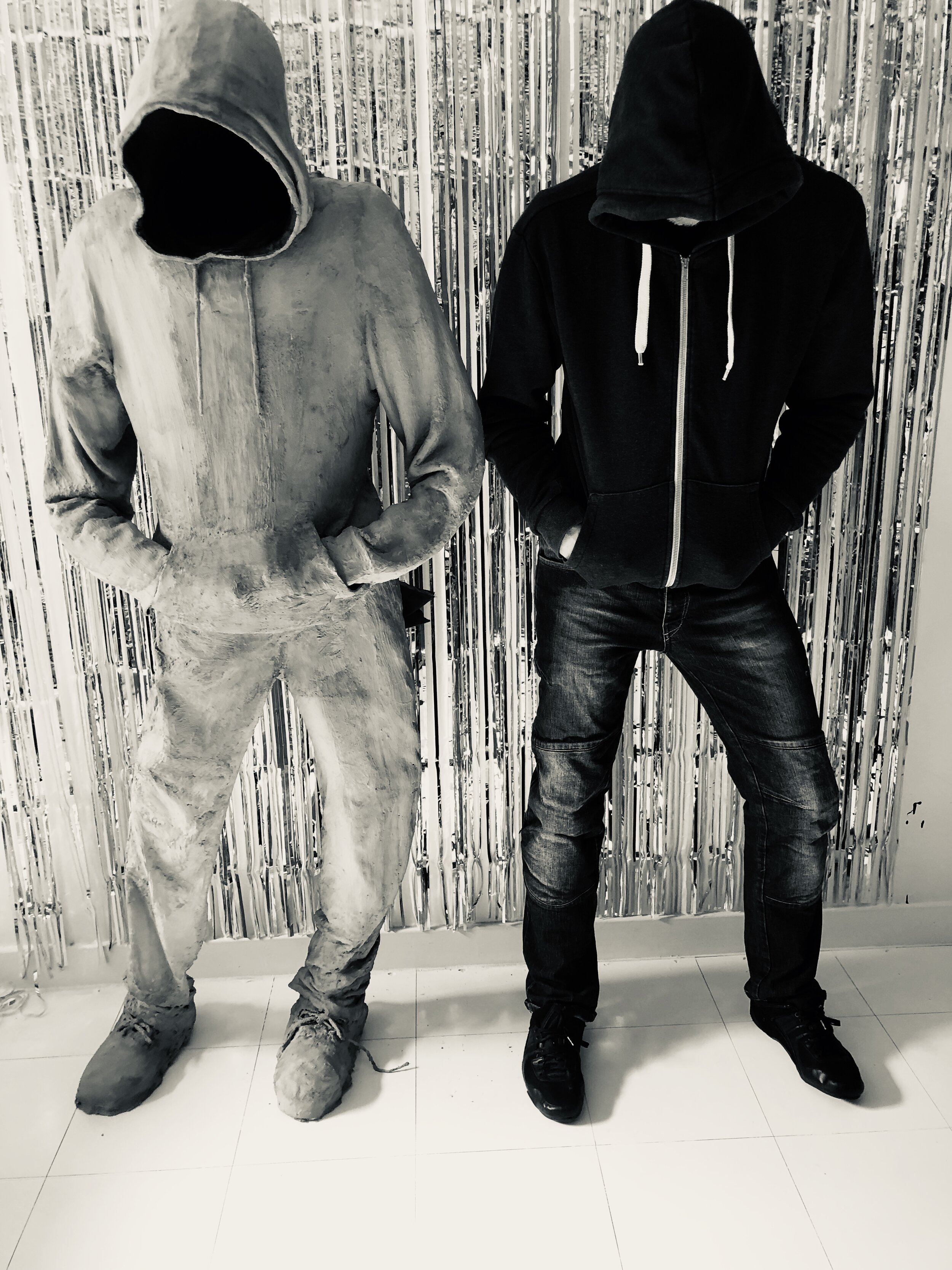 Conccrete 6 foot 2"Urban cowboy next to the live model