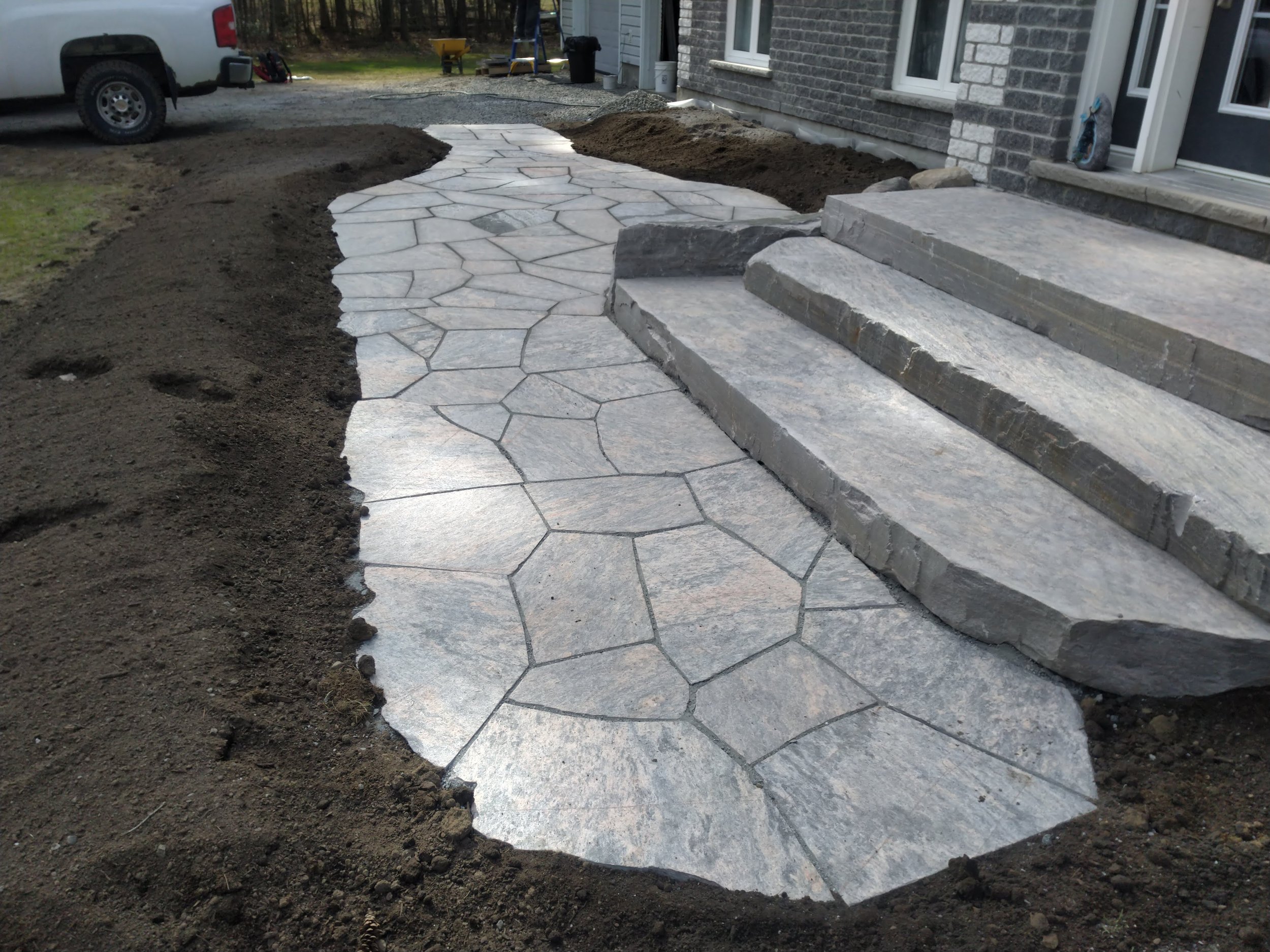 Natural rough cut walkway with perfectly cut stone steps. 